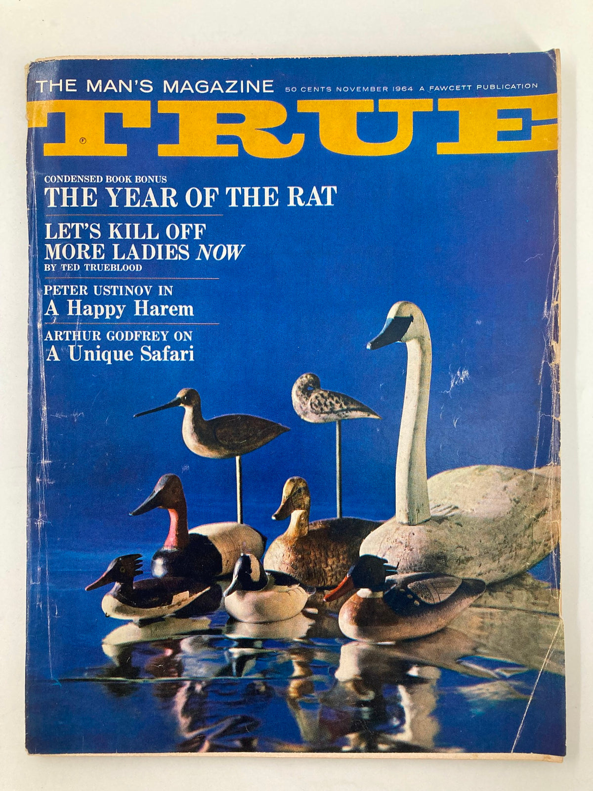 Cover of TRUE The Man's Magazine November 1964 featuring an array of decoys, showcasing details of vintage craftsmanship and iconic magazine branding.