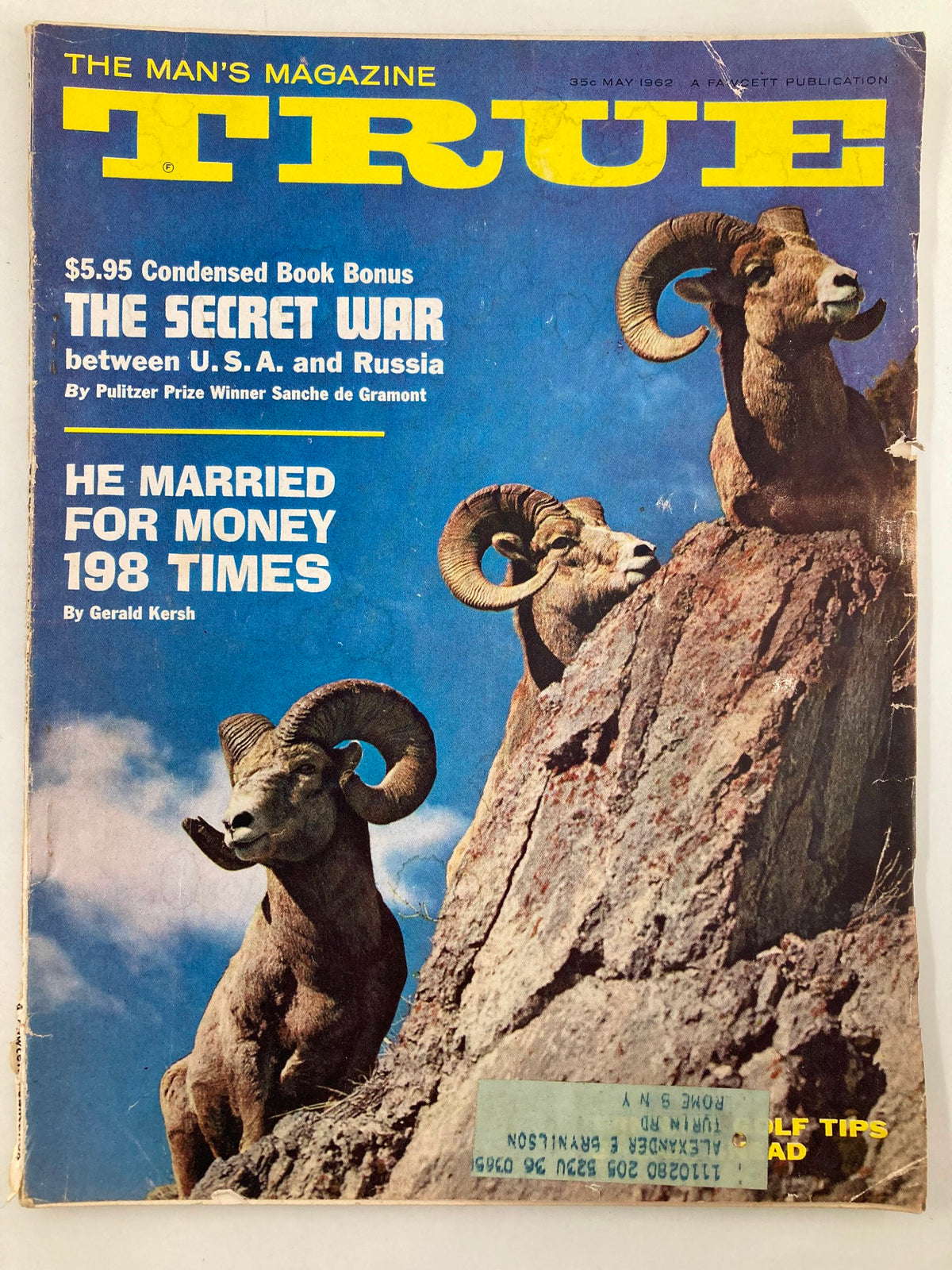Cover image of TRUE The Man's Magazine May 1962 featuring the headline 'The Secret War Between U.S. and Russia', showcasing a striking photograph of two rams on a rocky terrain.