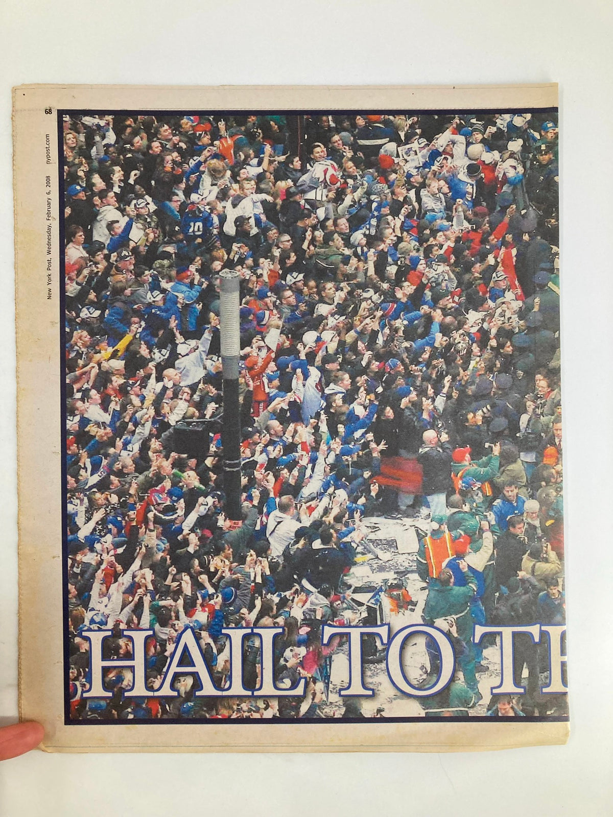 New York Post Newspaper dated February 6, 2008, featuring a vibrant scene celebrating the New York Giants with fans cheering and waving in excitement, titled 'Giants Hail To The Heroes'.