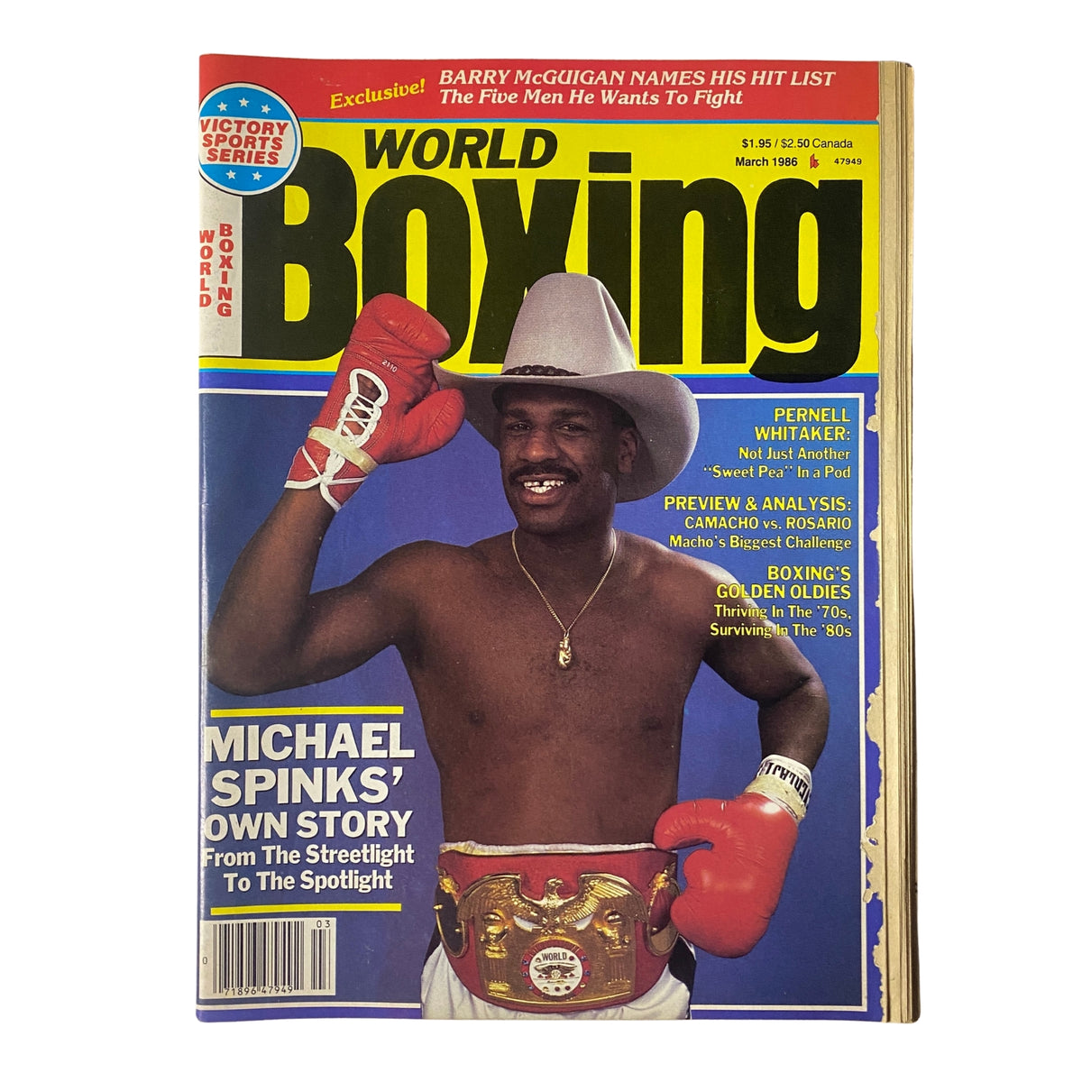 World Boxing Magazine March 1986 cover featuring Michael Spinks with his heavyweight championship belt and boxing gloves, showcasing his iconic look and the highlights of the issue including features on Pernell Whitaker and Barry McGuigan.