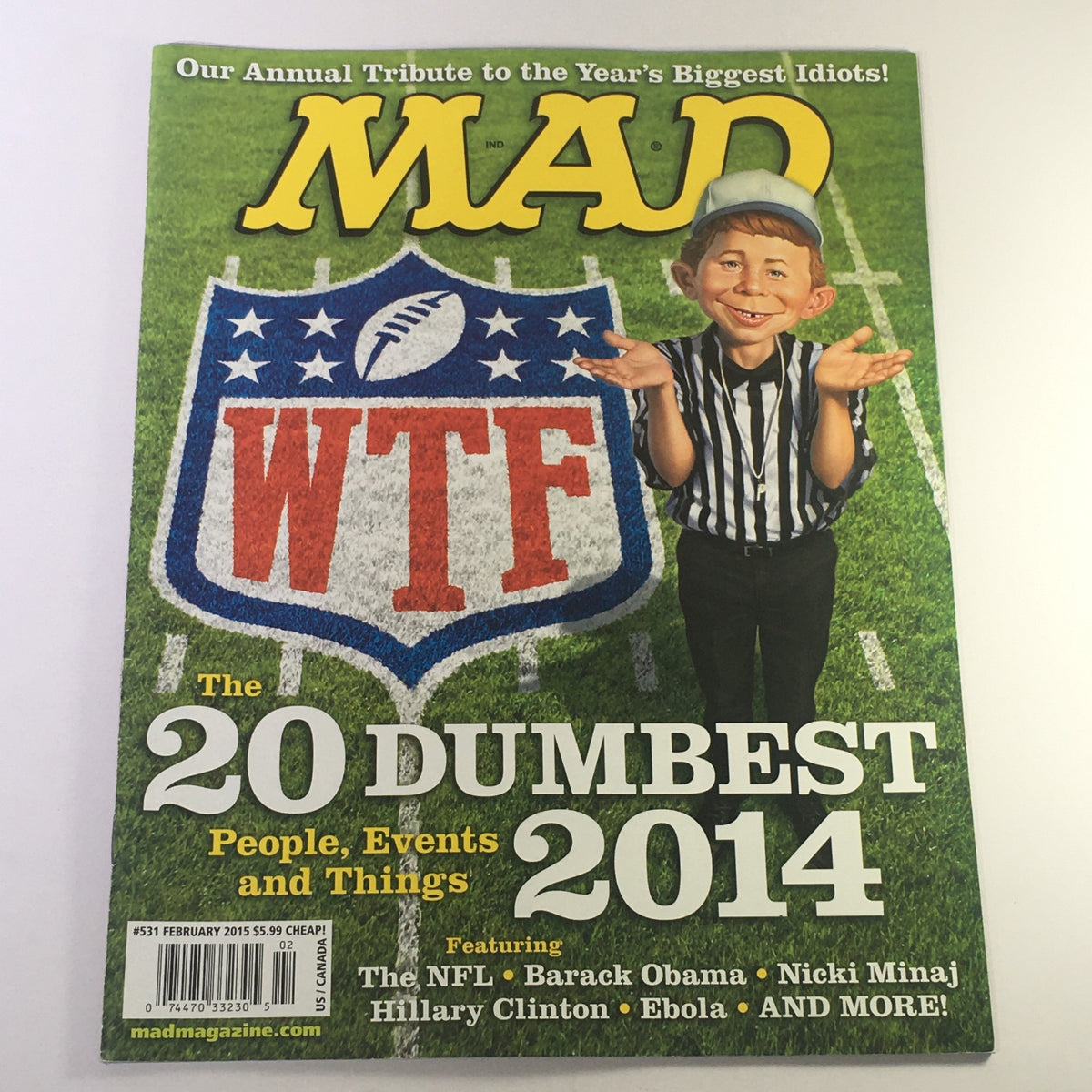 Cover of MAD Magazine February 2015 featuring a humorous illustration related to the NFL, Barack Obama, Nicki Minaj, and the Ebola crisis, amidst the title '20 Dumbest People, Events and Things 2014'.