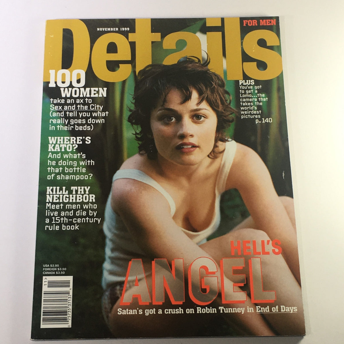 Details Magazine November 1999 cover featuring the headline 'Hell's Angel: Satan's Got a Crush on Robin Tunney'. The cover displays a young woman with curly hair looking directly at the camera, promoting articles about women and pop culture trends of the late '90s.