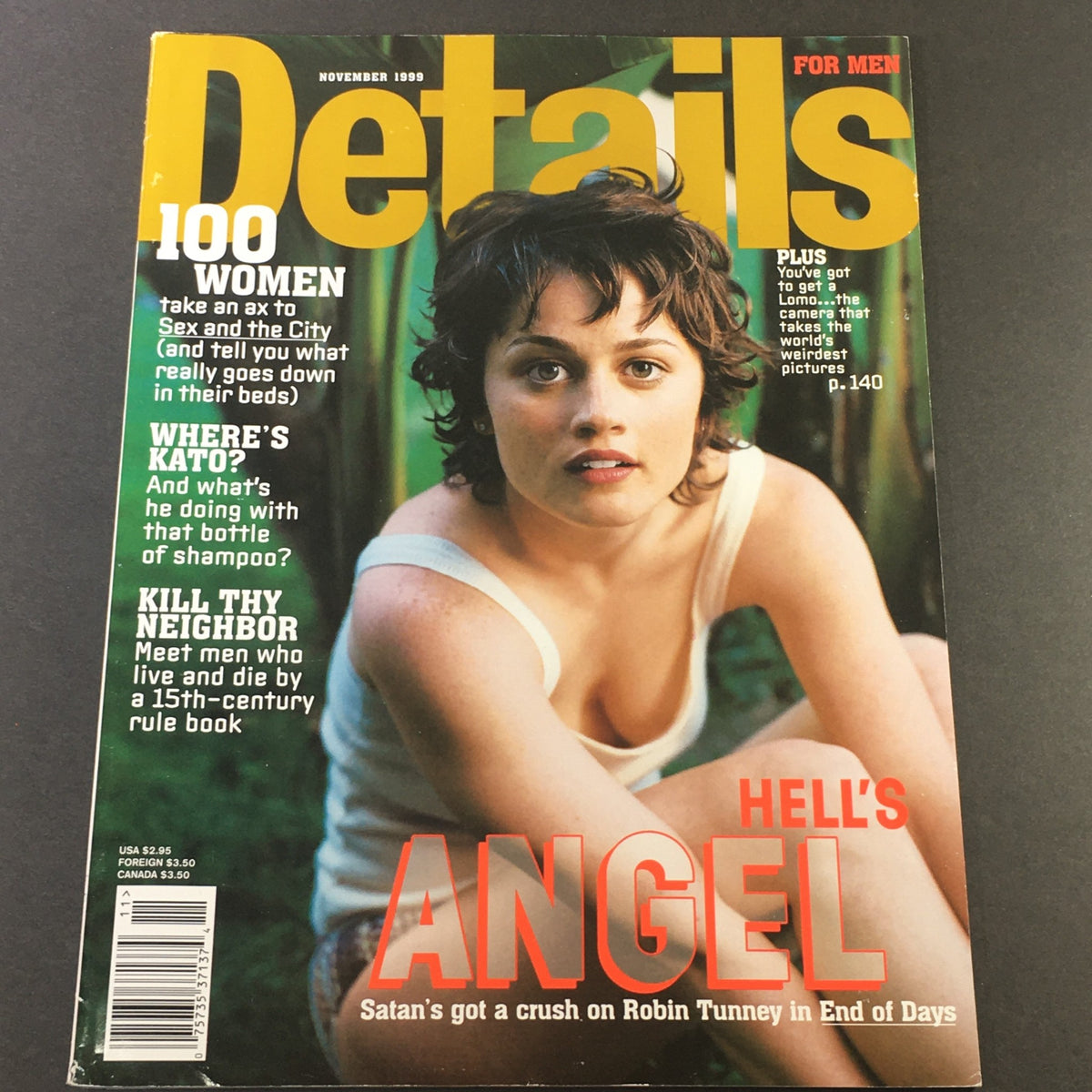 Details Magazine November 1999 cover featuring Robin Tunney, highlighting a 15th-century rule book article and themed with vibrant late 90s pop culture.