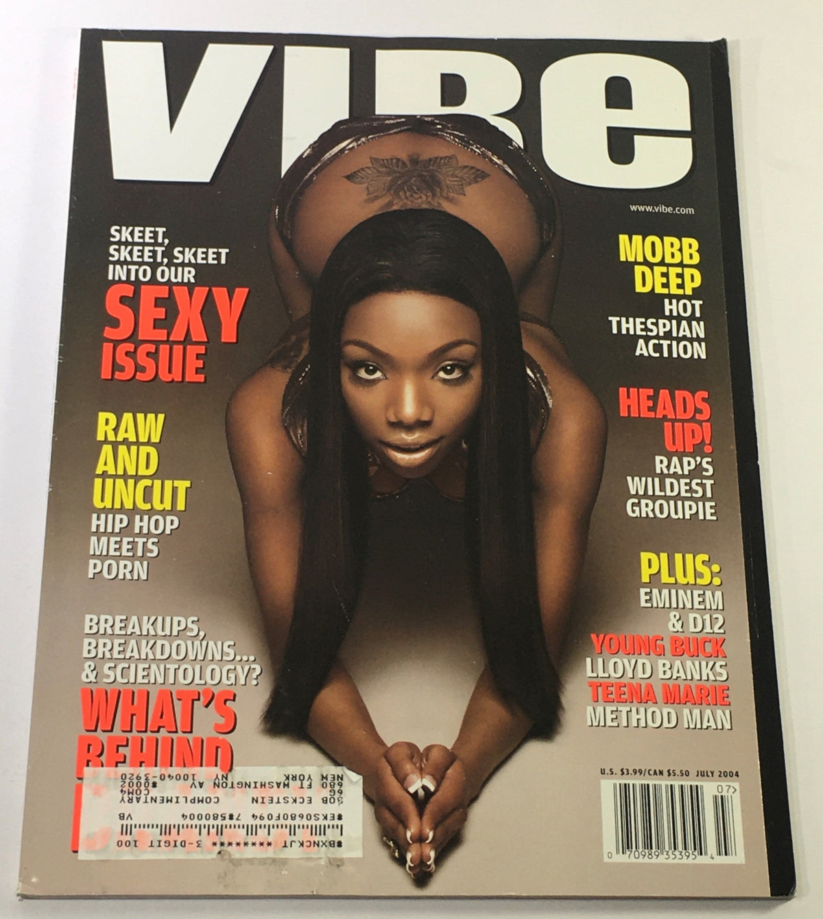 Vibe Magazine July 2004 cover featuring Brandy in a sexy pose, highlighting the themes of hip hop culture, Mobb Deep, and raw and uncut content.