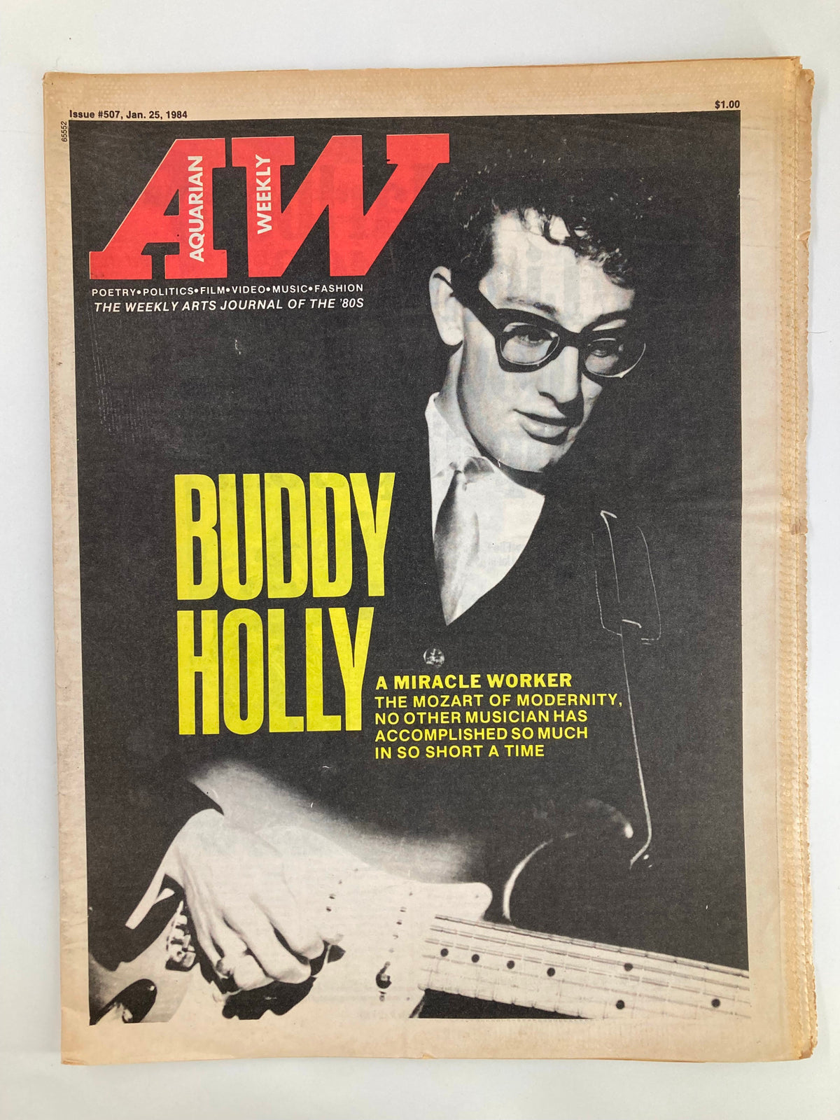 Cover of VTG Aquarian Weekly Newspaper January 25 1984 featuring Buddy Holly, titled 'A Miracle Worker: The Mozart of Modernity'. The image showcases Buddy Holly with a guitar and glasses, emphasizing his impact on modern music.