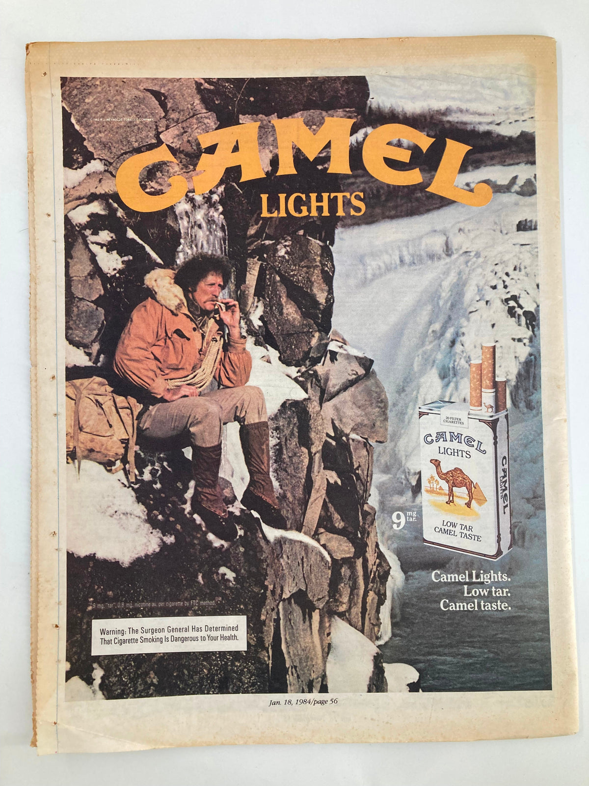 Cover of the VTG Aquarian Weekly Newspaper dated January 25, 1984, featuring the title 'Buddy Holly: A Mozart of Modernity' with an image of a man sitting on a rock in a snowy landscape smoking a cigarette advertising Camel Lights.