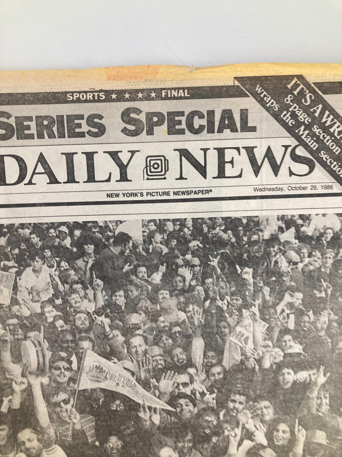VTG Daily News Newspaper from October 29, 1986, showcasing enthusiastic baseball fans celebrating in a crowd, highlighting the excitement surrounding Darry Strawberry and the New York Mets. This vintage newspaper captures a memorable moment in sports history.
