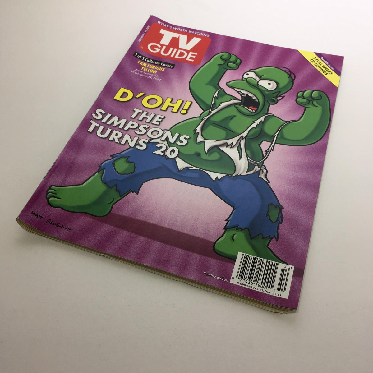 Front cover of the TV Guide celebrating The Simpsons turning 20, titled 'D'OH! The Simpsons Turns 20', highlighting its significance in TV history.