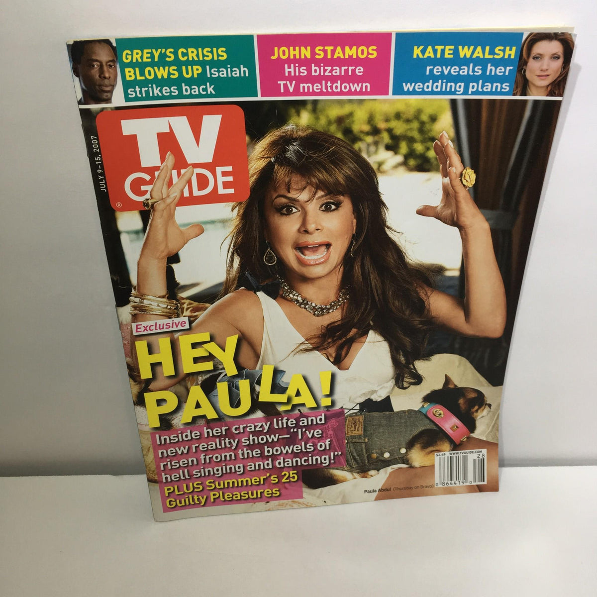 TV Guide cover from July 9-15, 2007 featuring an exclusive story on Paula Abdul, depicting her lively expression and a casual pose. The magazine showcases headlines about her career, including her rise in music and dance.