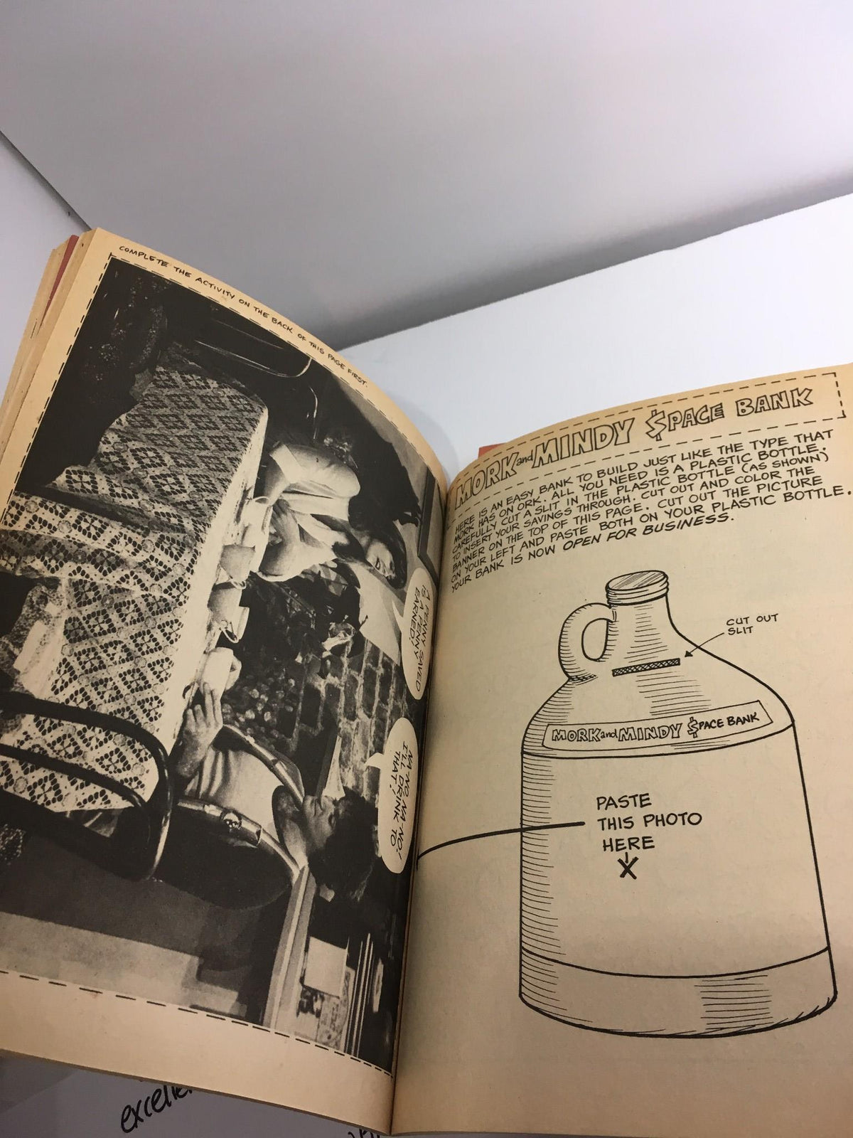 Interior page of The Mork & Mindy Activity Book displaying an interactive space bank craft instruction.
