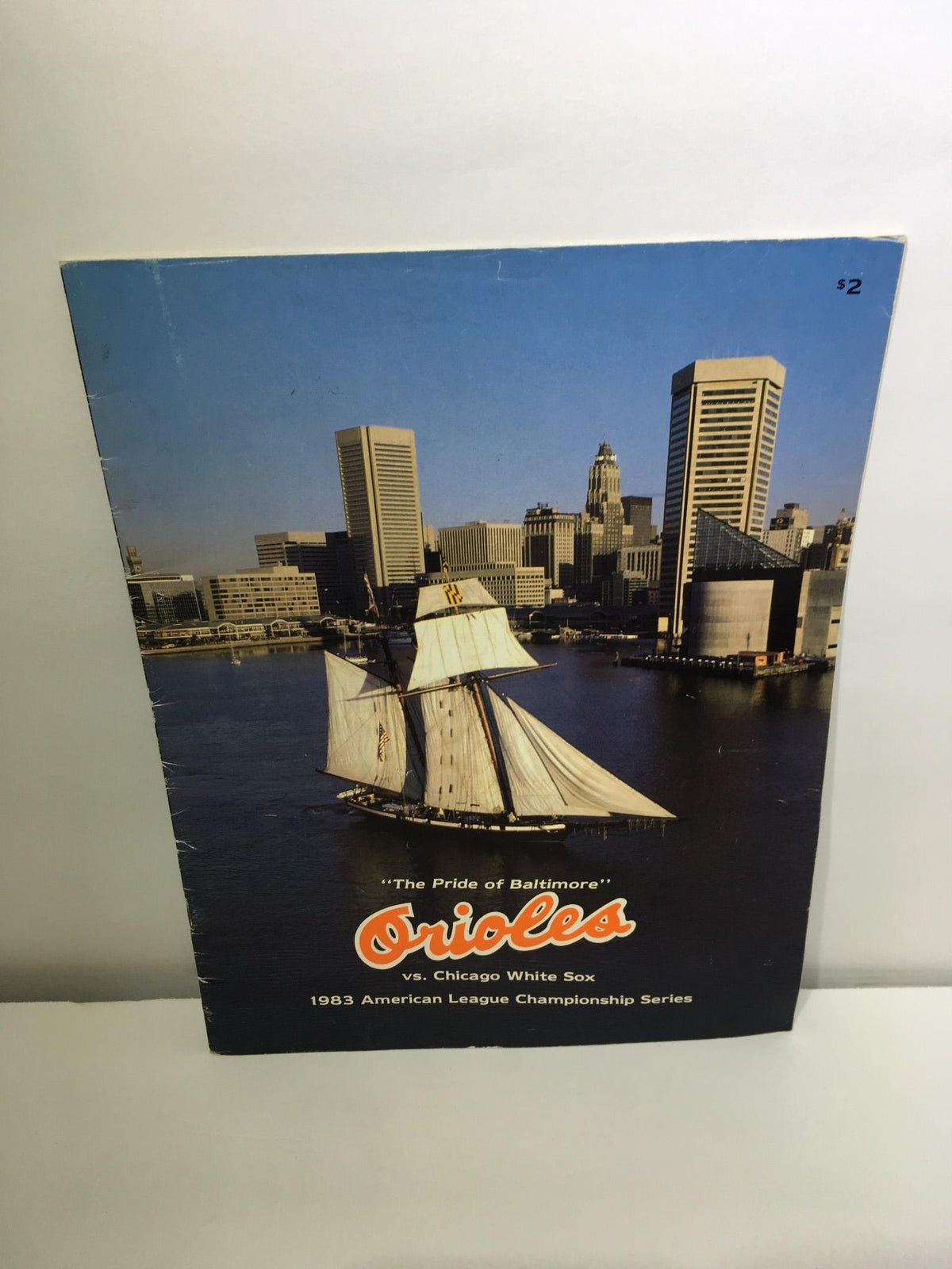 Cover image of the 1983 ALCS titled 'The Pride of Baltimore Orioles VS Chicago White Sox', featuring a sailboat in Baltimore harbor with city skyline in the background.
