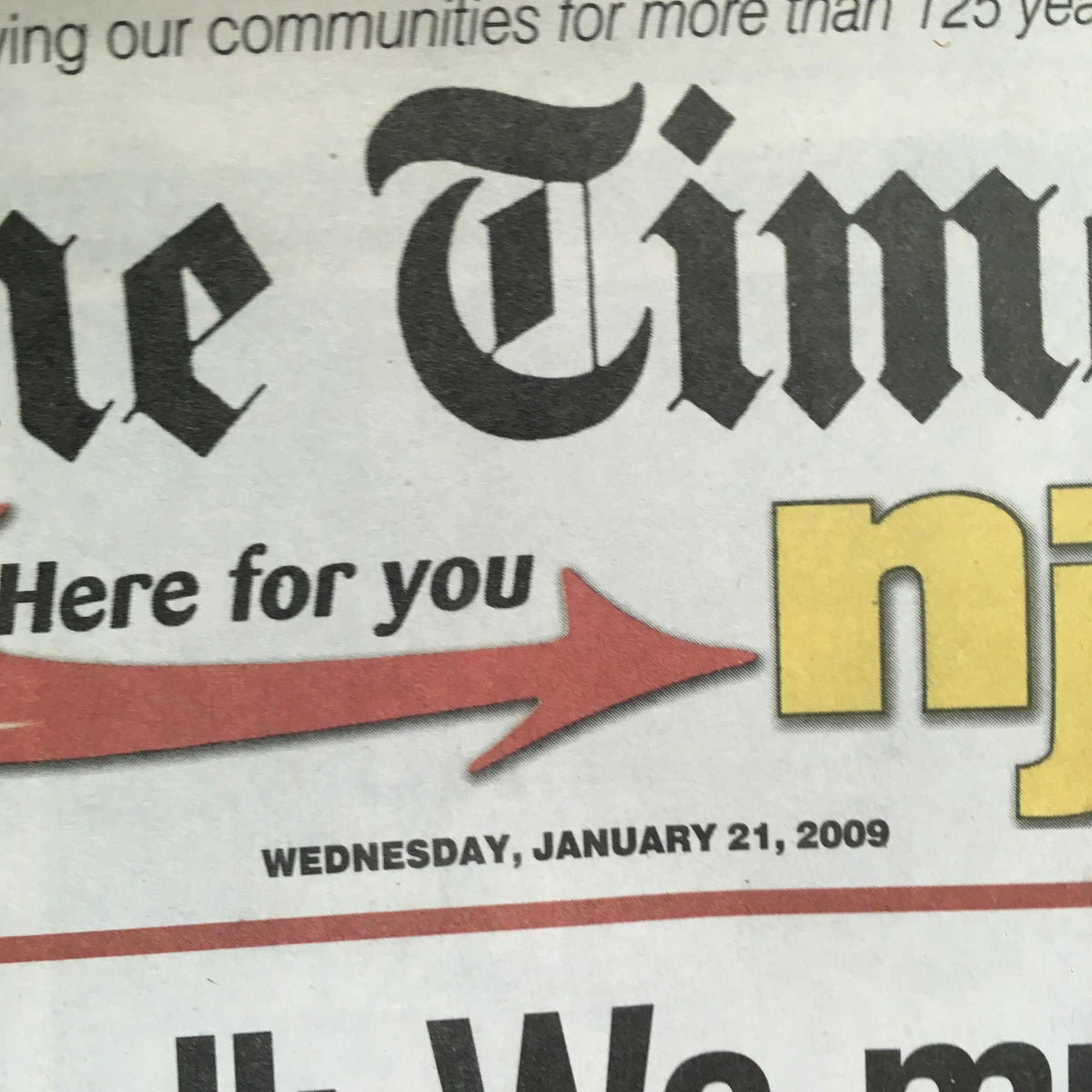 Close-up view of the top portion of 'The Times: 01/21/09 Obama's Call Must Begin The Work of Remarking America' newspaper featuring the date and logo.