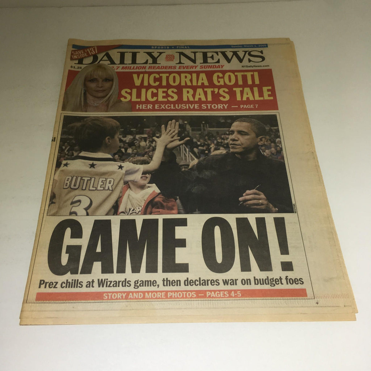 New York Daily News March 1 2009 cover featuring President Obama at a Wizards game, capturing the headline 'GAME ON!' alongside a photo of the president interacting with a fan.