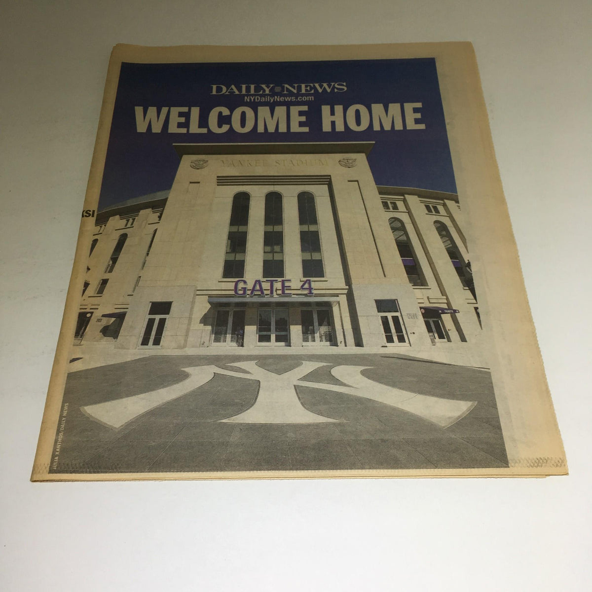 New York Daily News, March 29 2009 edition, featuring the headline 'Welcome Home' with an image of the exterior of a stadium, emphasizing the entrance and 'GATE 4' sign.