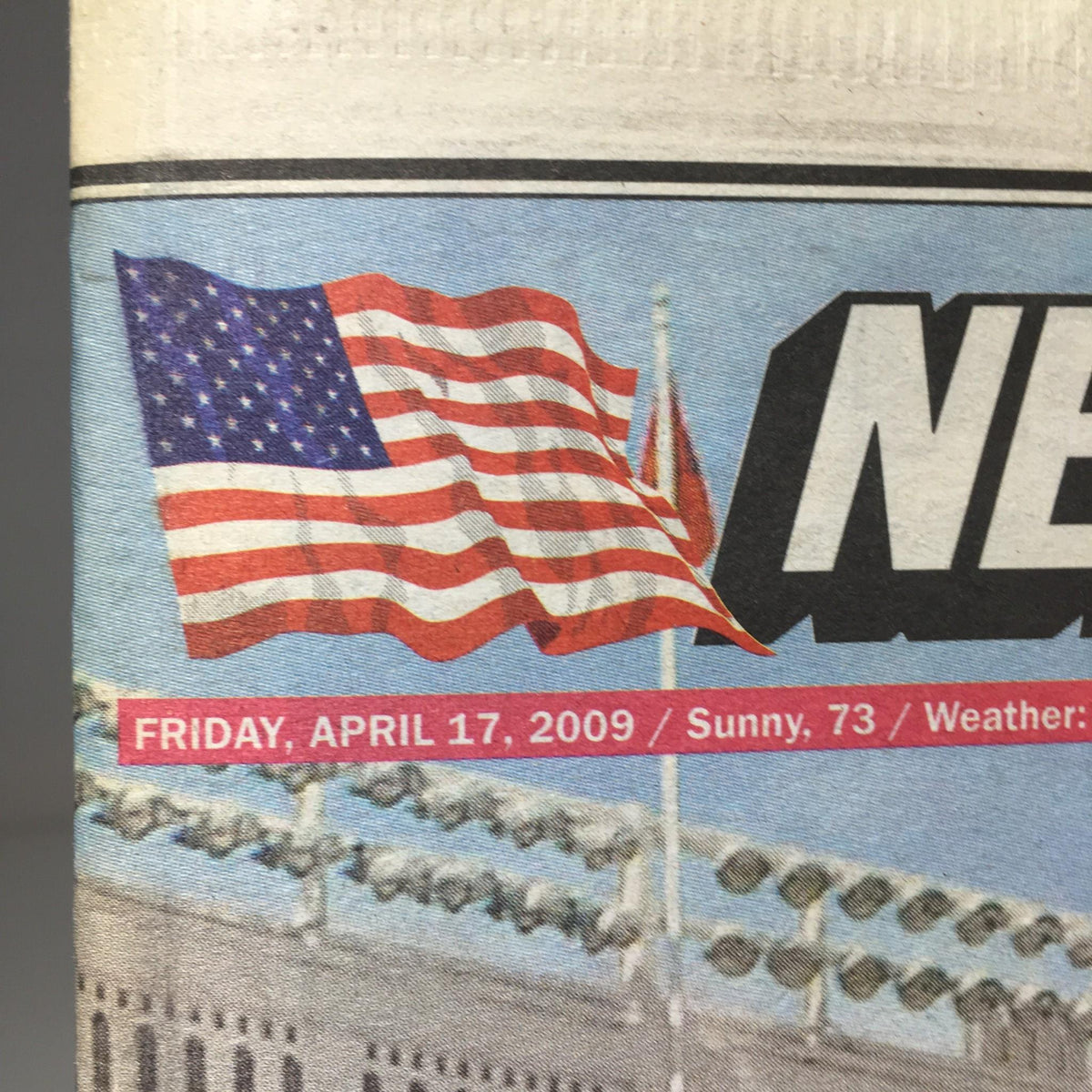 Close-up of the New York Post dated April 17, 2009, highlighting the date and weather, along with the iconic Yankees logo and American flag.