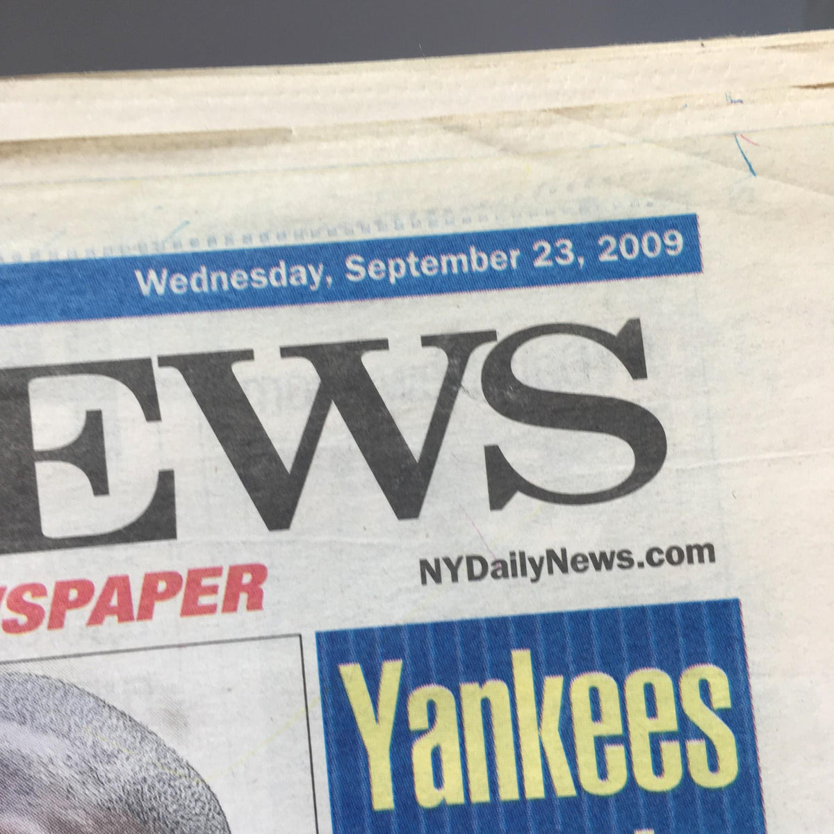 Close-up of the NY Daily News header dated Wednesday, September 23, 2009, featuring the newspaper's logo and date.