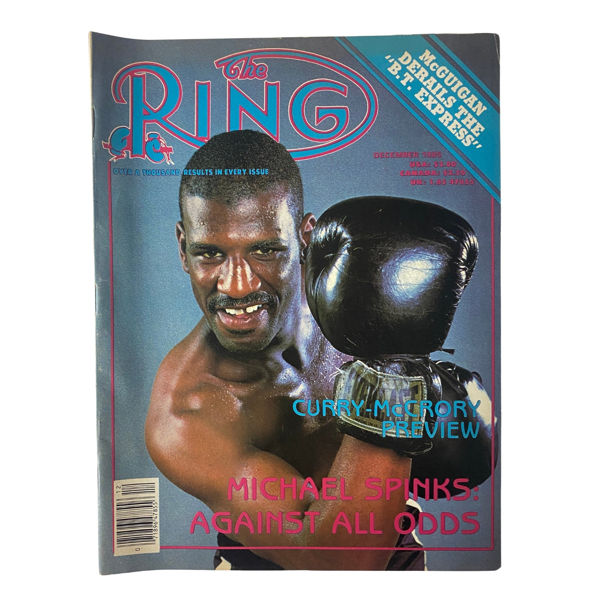 Cover of The Ring Magazine, December 1985 featuring Michael Spinks in boxing gloves. Highlights include a preview of Curry vs. McCrory and an article titled 'Michael Spinks: Against All Odds'. Very good condition, no label.