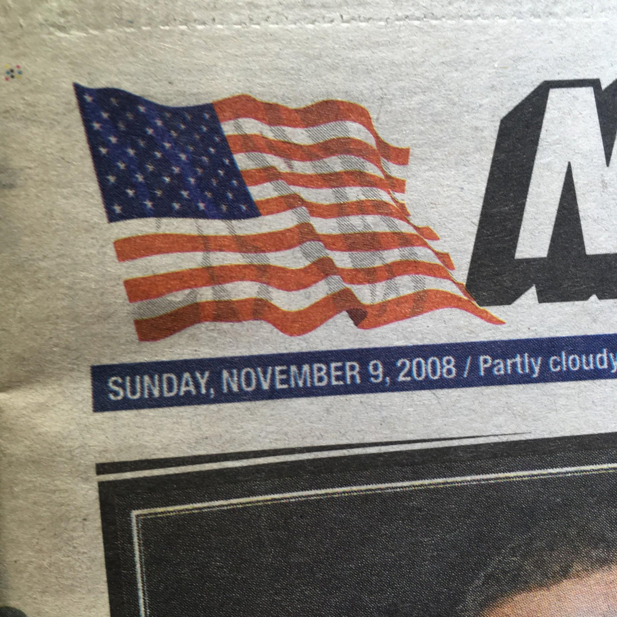 The top portion of the New York Post front page dated Sunday, November 9, 2008, displaying an American flag and the date, highlighting the historical significance of Barack Obama's election.