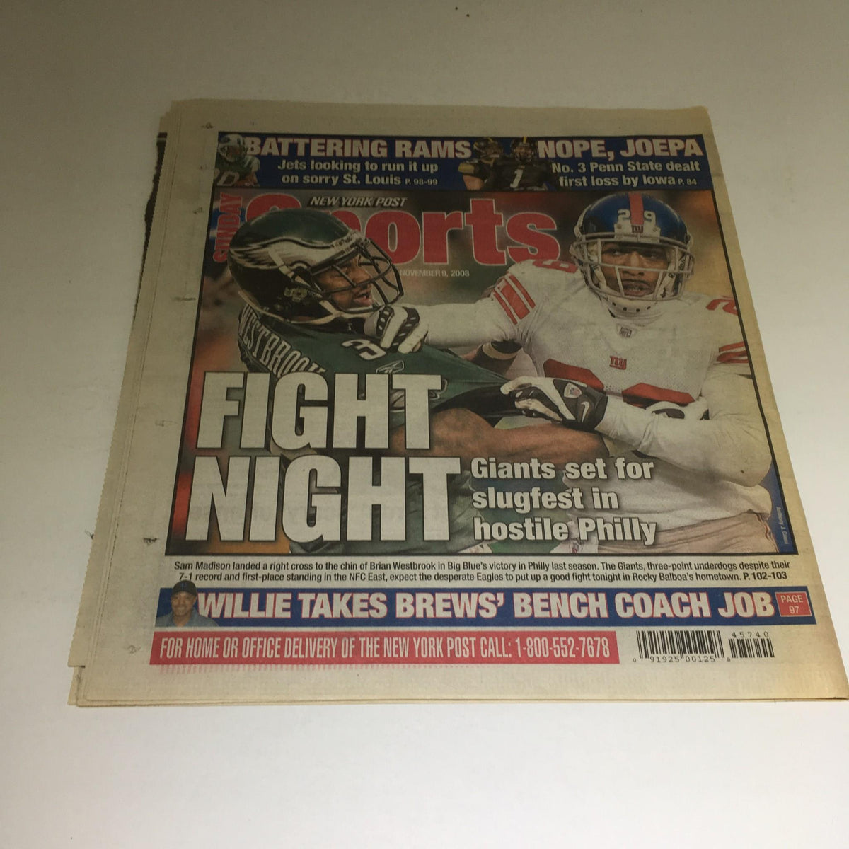 New York Post cover dated November 9, 2008, depicting a sports headline titled 'Fight Night,' featuring images related to sports events, contrasting the Obama headline on the previous page.