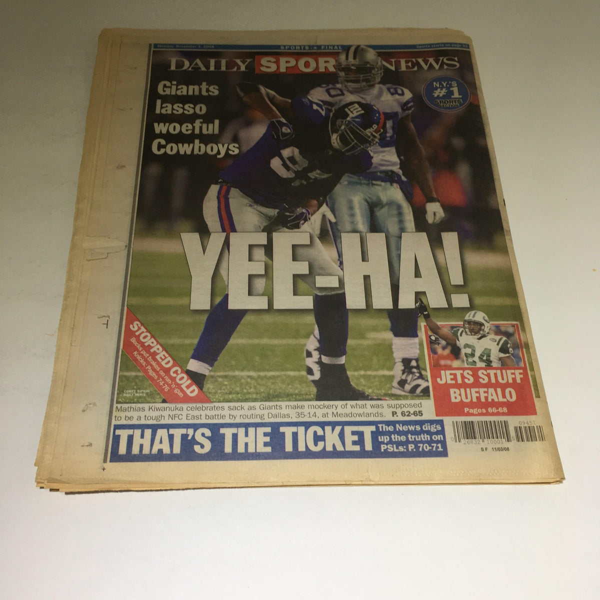 NY Daily News front page featuring headline 'YEE-HA!' with a photo of Matthias Kiwanuka celebrating after a game, illustrating Giants defeating Cowboys.