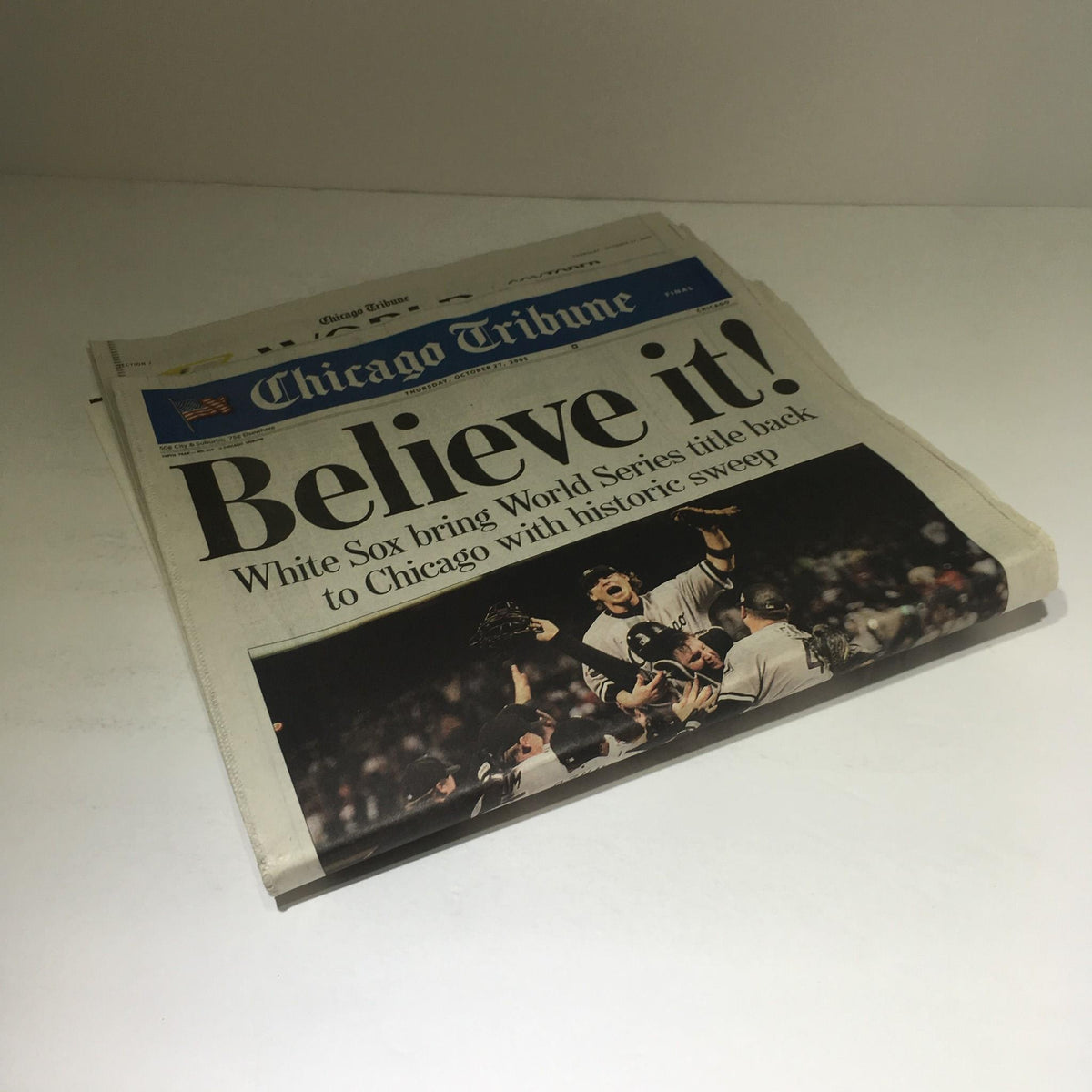 Chicago Tribune front page asserting 'Believe it! White Sox bring World Series title back to Chicago with historic sweep' showcasing a striking celebratory image.
