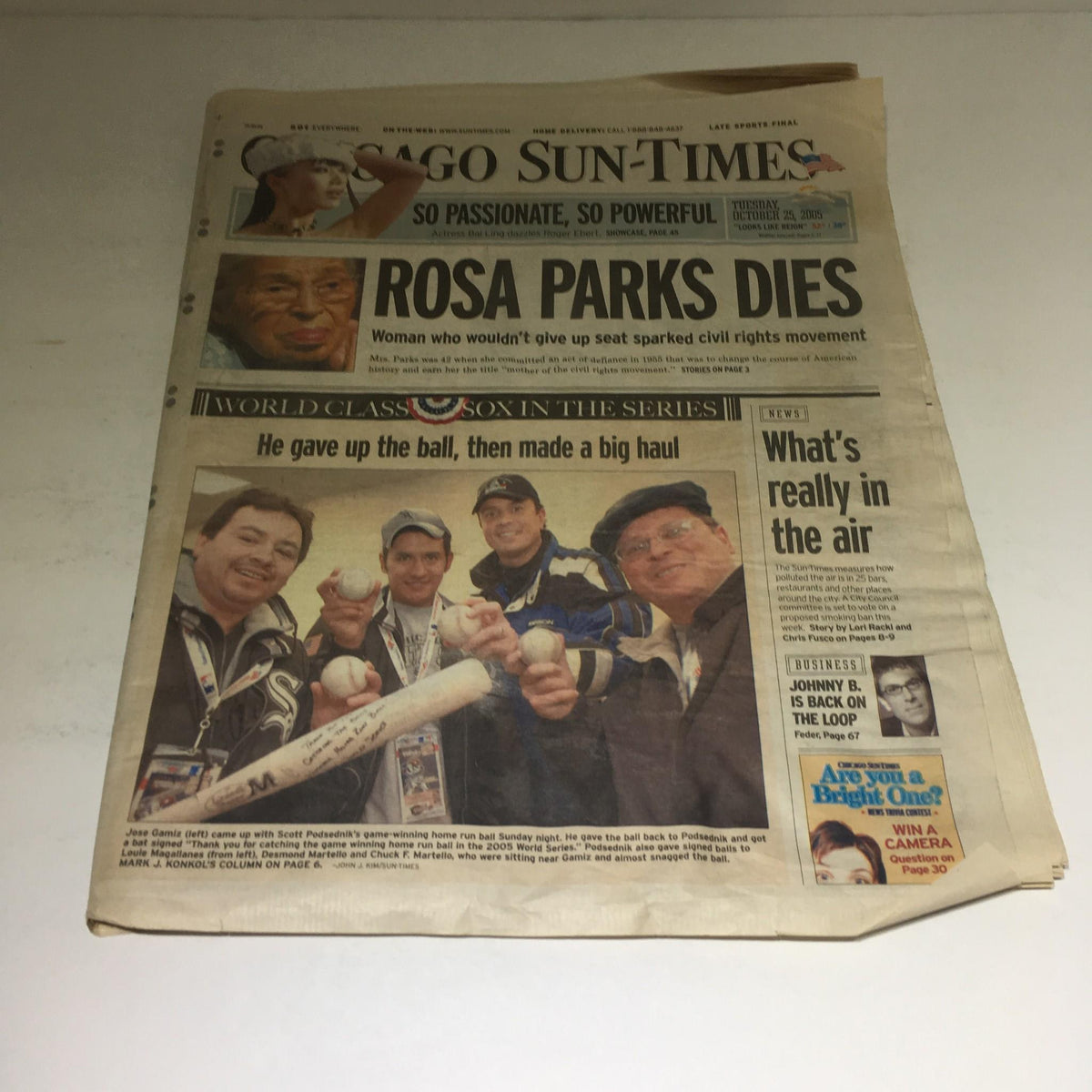 Chicago Sun-Times newspaper from October 25, 2005, featuring the title 'He Gave Up the Ball Then Made a Big Haul,' showcasing sports fans and memorabilia.