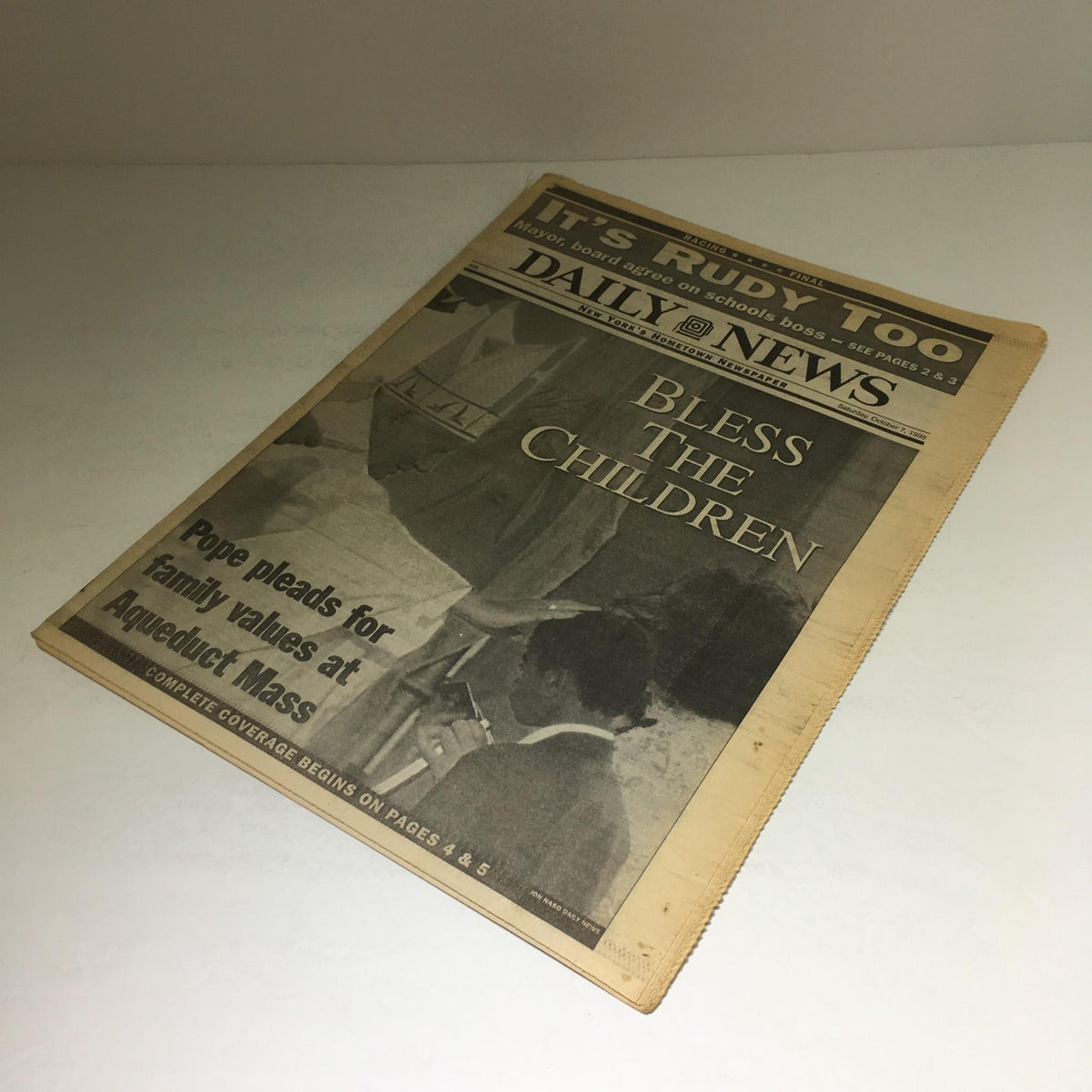 Cover of NY Daily News from October 7, 1995, highlighting the Pope's message to bless children during the Aqueduct Mass.
