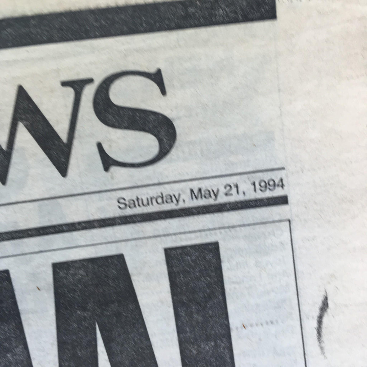 Detail of New York Daily News dated Saturday, May 21, 1994, featuring the headline 'Jackie to be buried at Arlington next to JFK'.