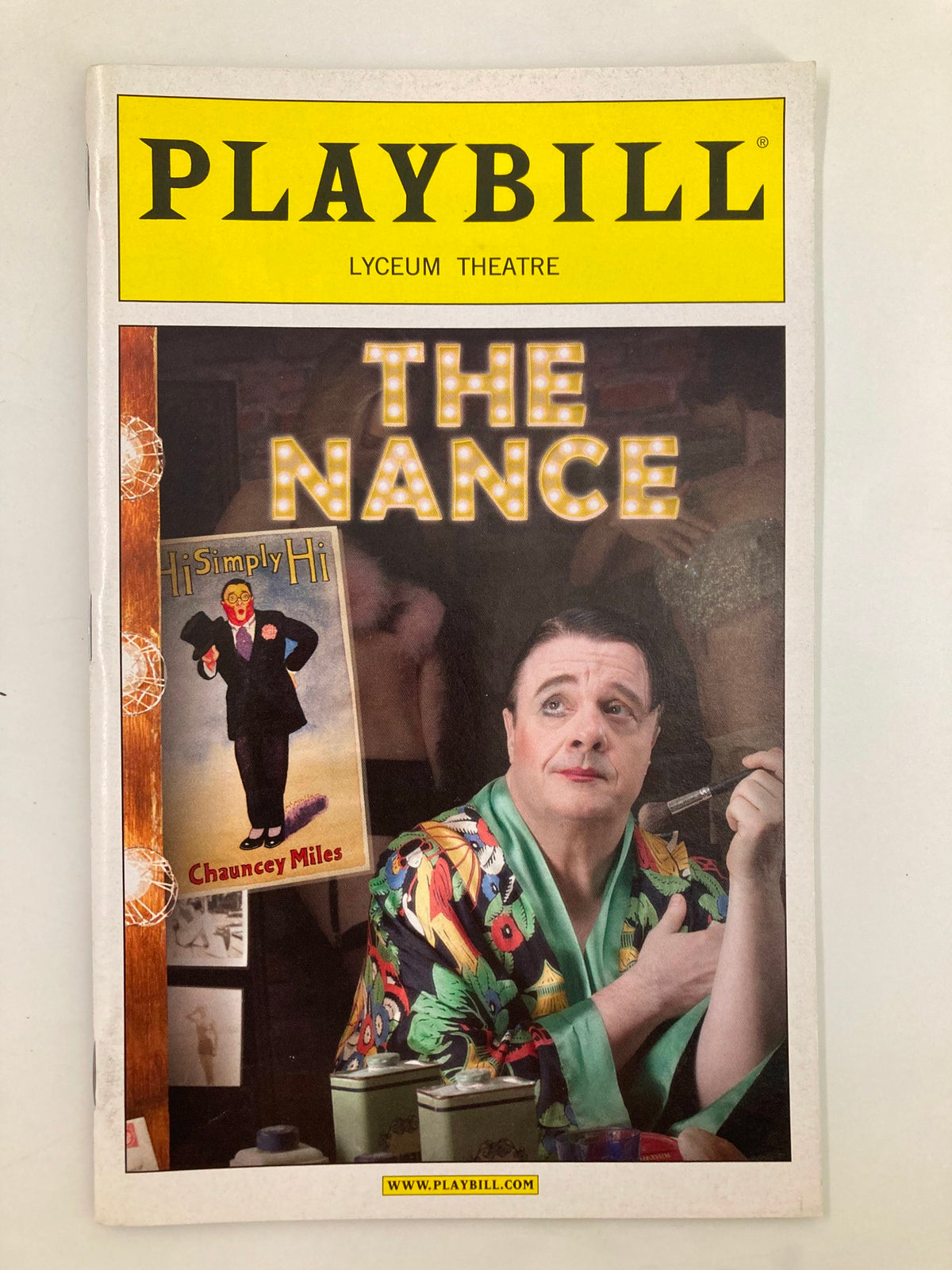 2013 Playbill for The Nance at the Lyceum Theatre featuring a colorful cover with prominent actor in a vibrant costume and lighting details from the performance.