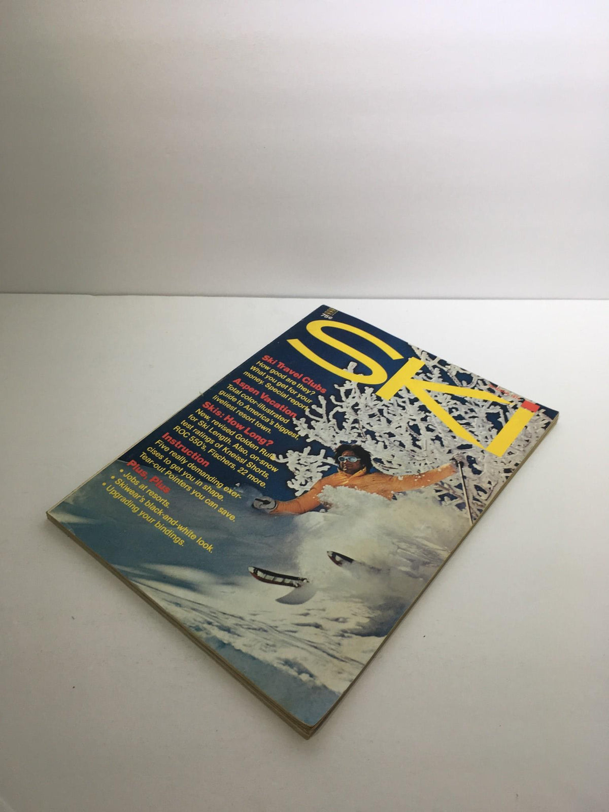 Front view of Ski Magazine October 1974 with a featured image of a skier in action, emphasizing ski travel and adventure.