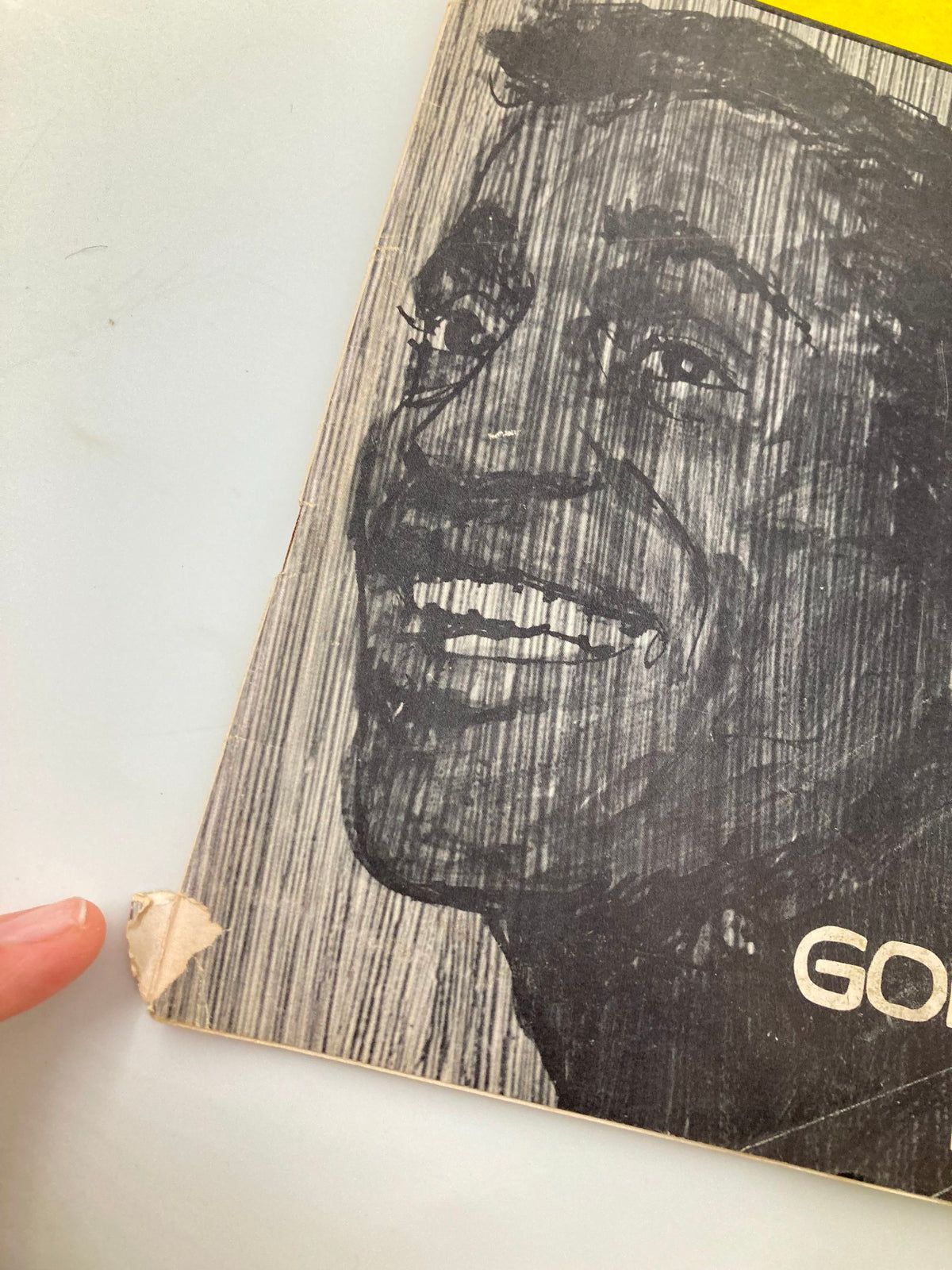 Close-up of the corner of the 1965 Playbill from Majestic Theatre for The New Musical Golden Boy, highlighting minor wear on the cover.