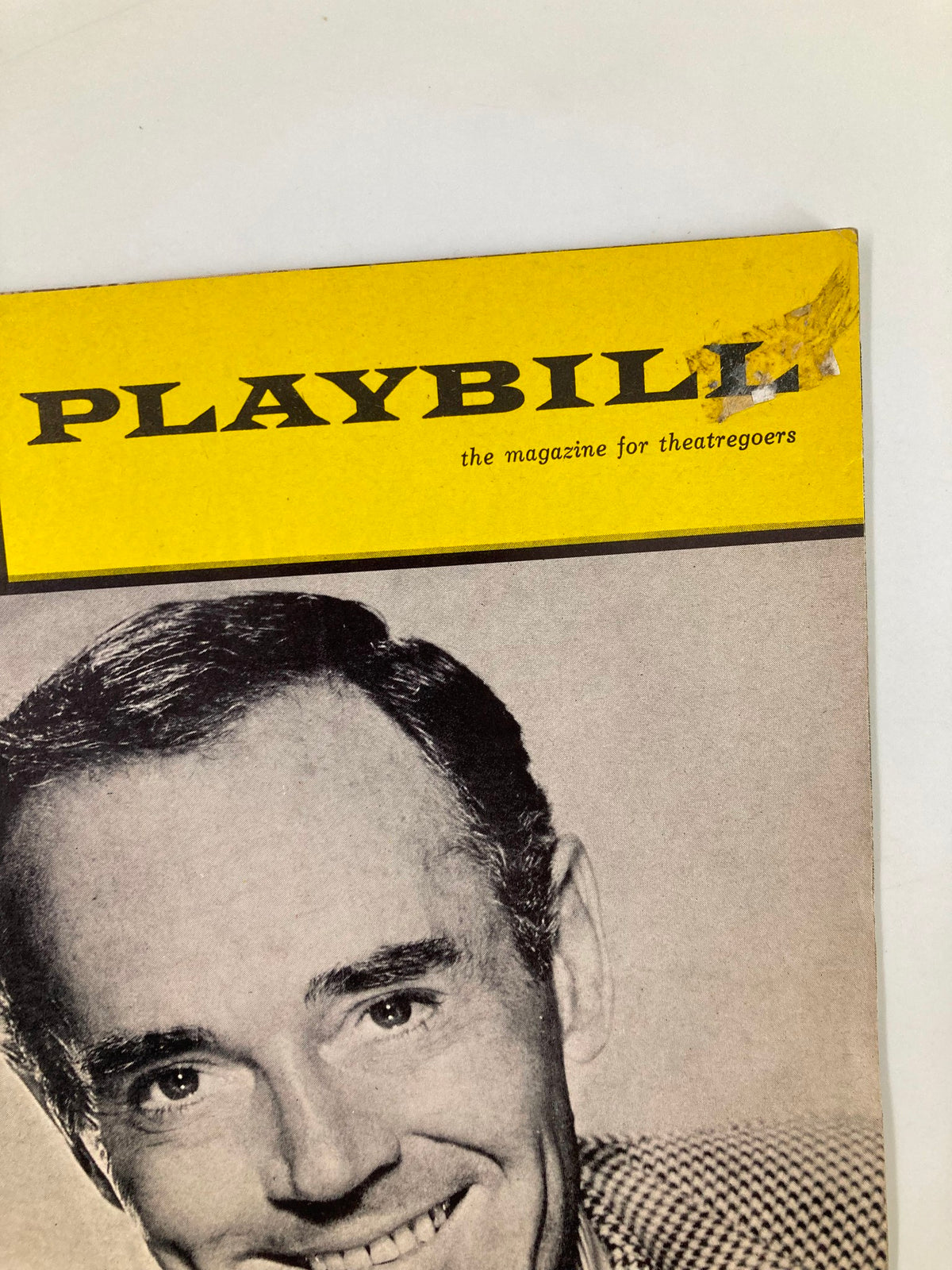 Close-up of the 1966 Playbill for 'A New Comedy Generation' featuring Henry Fonda, highlighting the cover's yellow and gray design with a small mark.