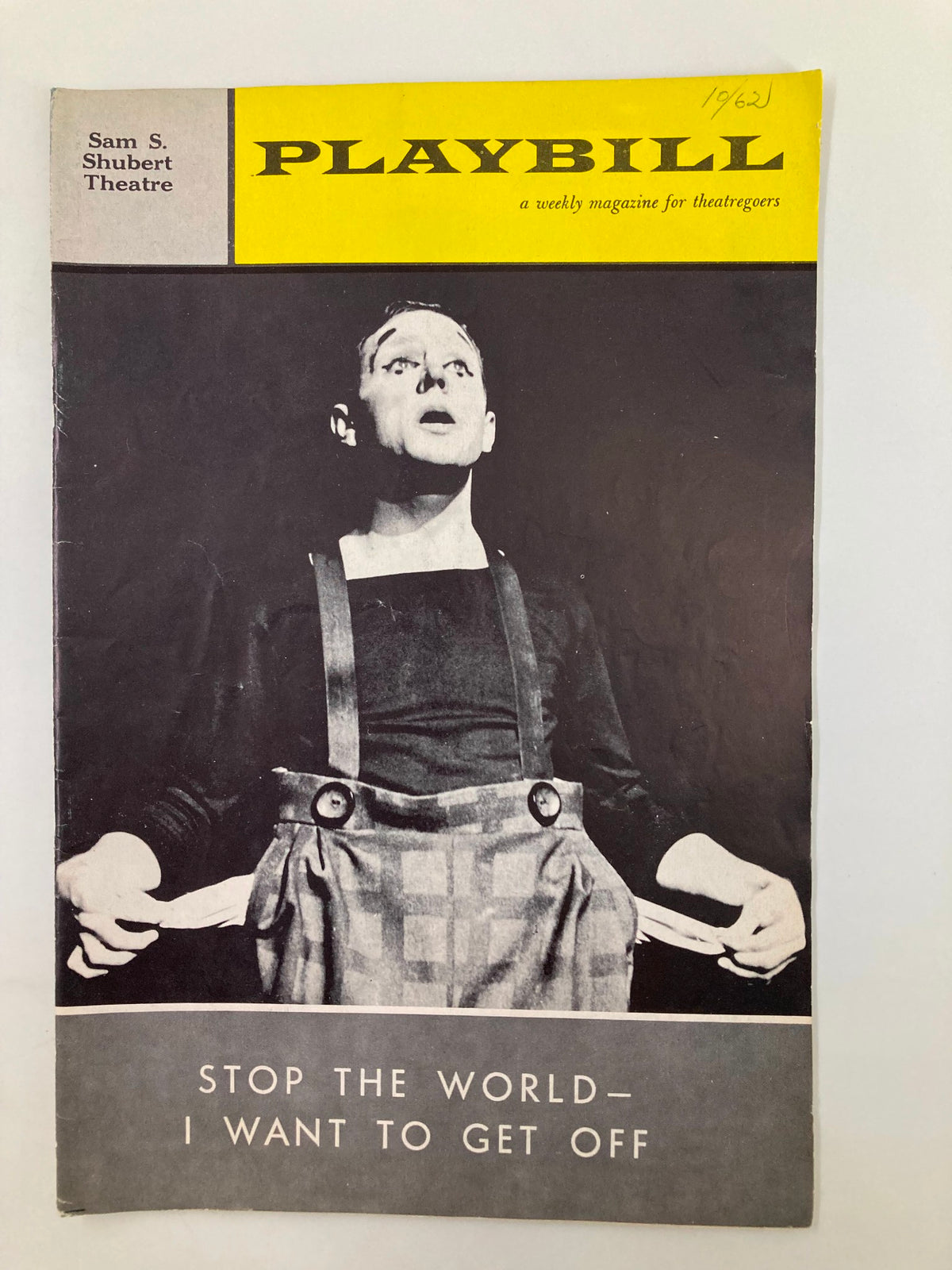 1962 Playbill for 'Stop The World I Want To Get Off' at the Sam S. Shubert Theatre, showcasing a captivating theatrical performance.