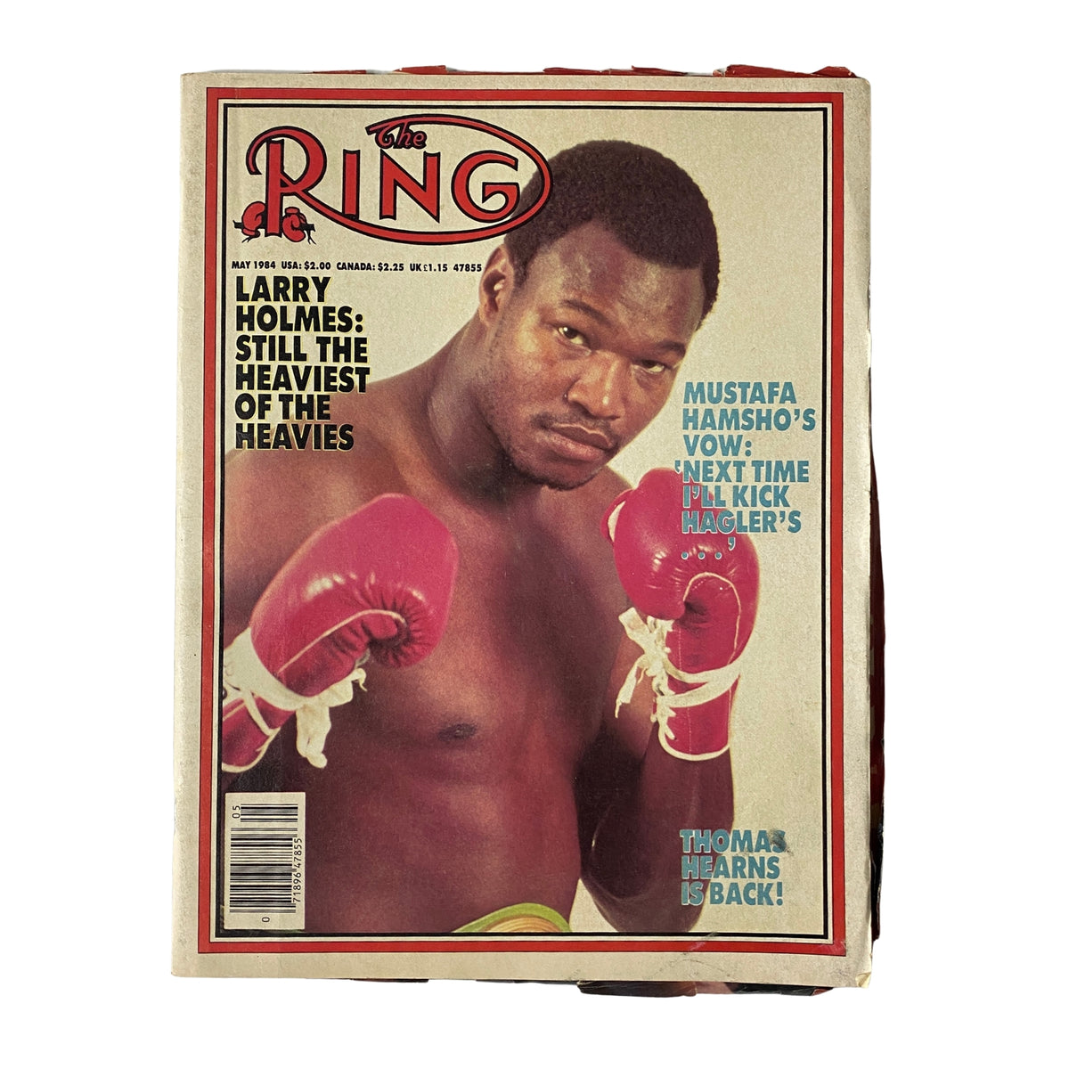The Ring Magazine cover from May 1984 featuring heavyweight champion Larry Holmes, with the headline 'Larry Holmes: Still the Heaviest of the Heavies', showcasing Holmes in boxing gloves ready for action.