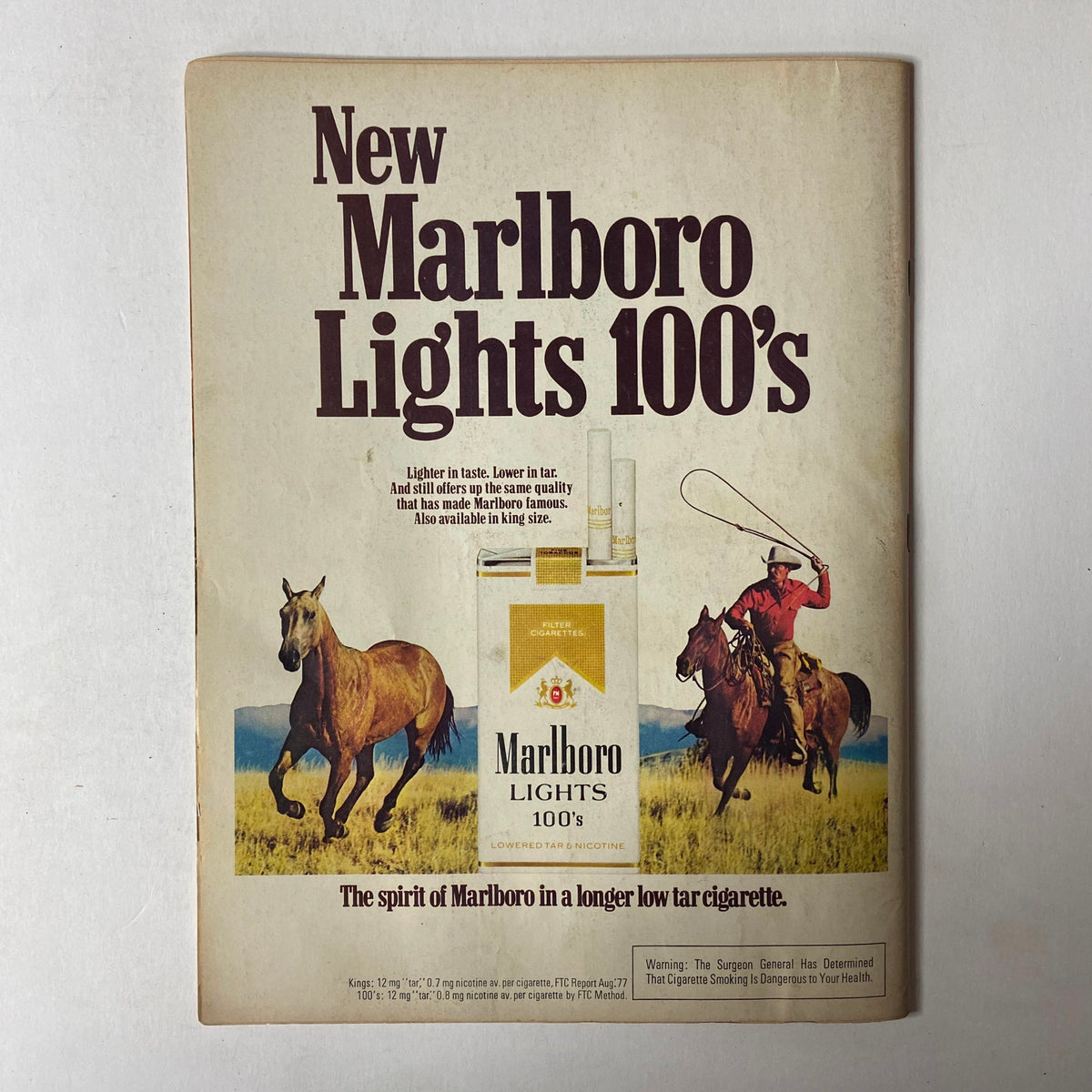 Vintage advertisement for New Marlboro Lights 100's cigarettes featuring a scenic horse riding theme, emphasizing the brand's quality and low tar attributes.