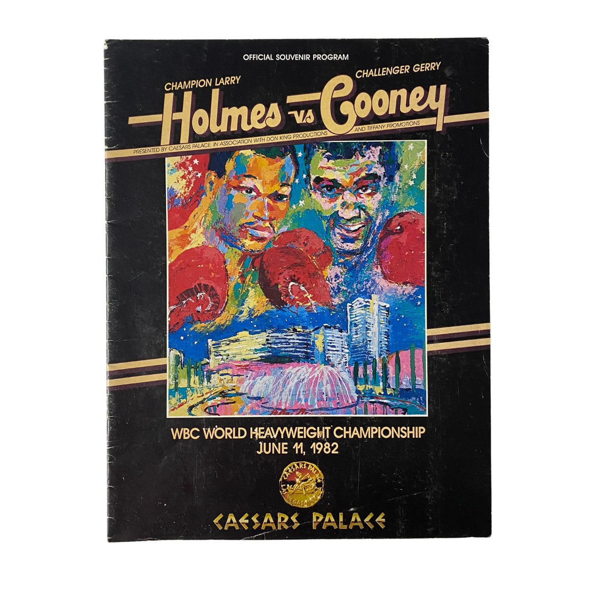 1982 Caesar's Palace Larry Holmes vs. Gerry Cooney Official Souvenir Program cover featuring artwork of both boxers in a colorful design and the event details.