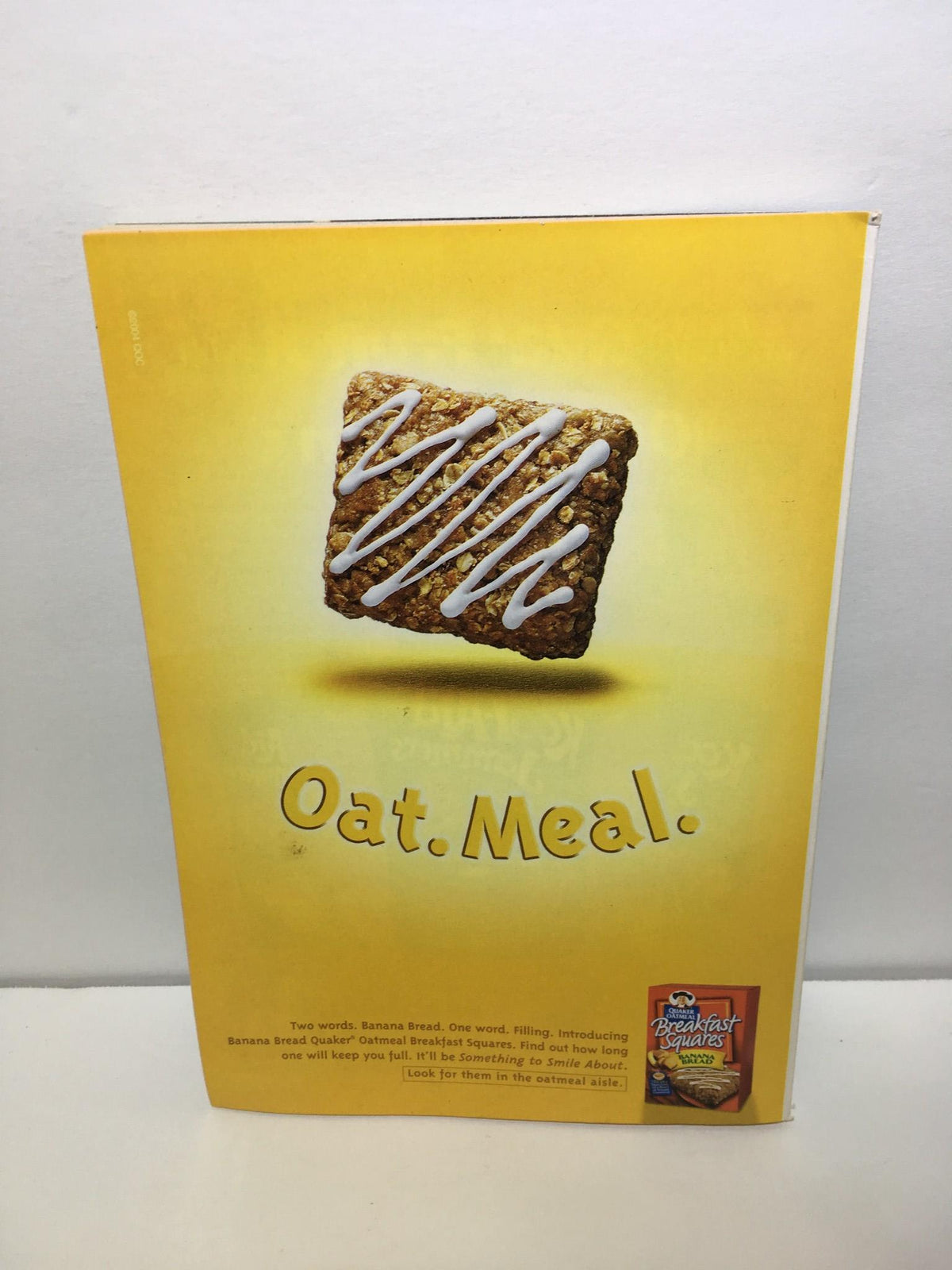 Advertisement featuring the slogan 'Oat. Meal.' on the back cover of the TV Guide February 13-19 2005 Johnny Carson Cover.
