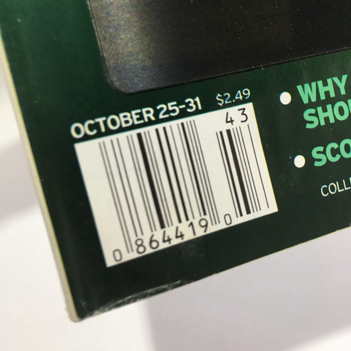 Close-up of the barcode on the back cover of TV Guide October 25-31, 2003, detailing the price and publication date.