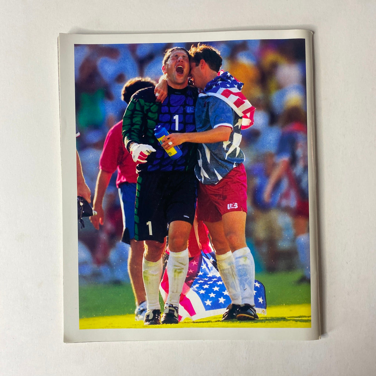 Sports Illustrated Magazine 1994 Year in Pictures depicting an emotional celebration from a soccer match with players expressing joy and camaraderie, marking significant moments in international soccer.