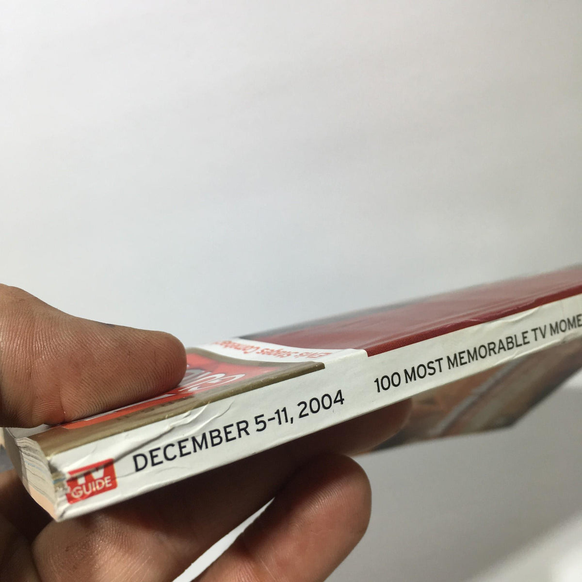 Side view of TV Guide December 5-11, 2004 showing the publication date and emphasizing '100 Most Memorable TV Moments'.