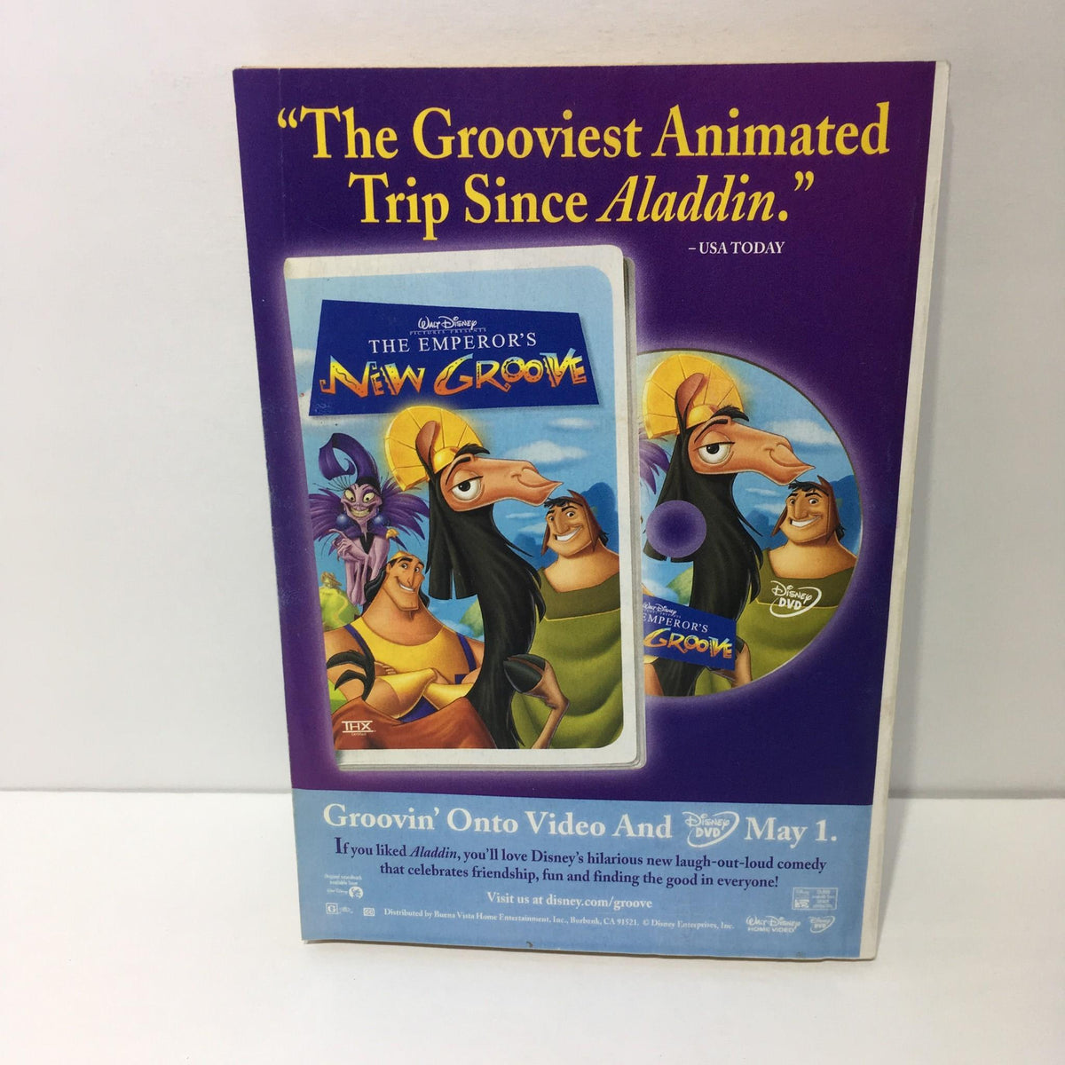 Promotional image for Disney's animated film The Emperor's New Groove, highlighting its release on video, stating it's 'The Grooviest Animated Trip Since Aladdin'.