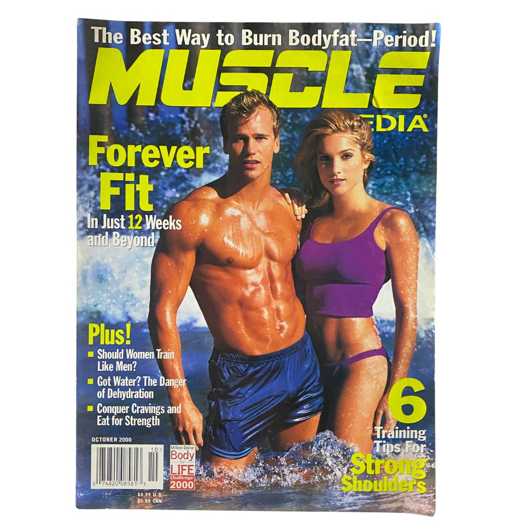 Muscle Media Magazine, October 2000, featuring training tips for strong shoulders, highlighted on the cover with a fit male model and a female model, embodying the fitness culture of the early 2000s.