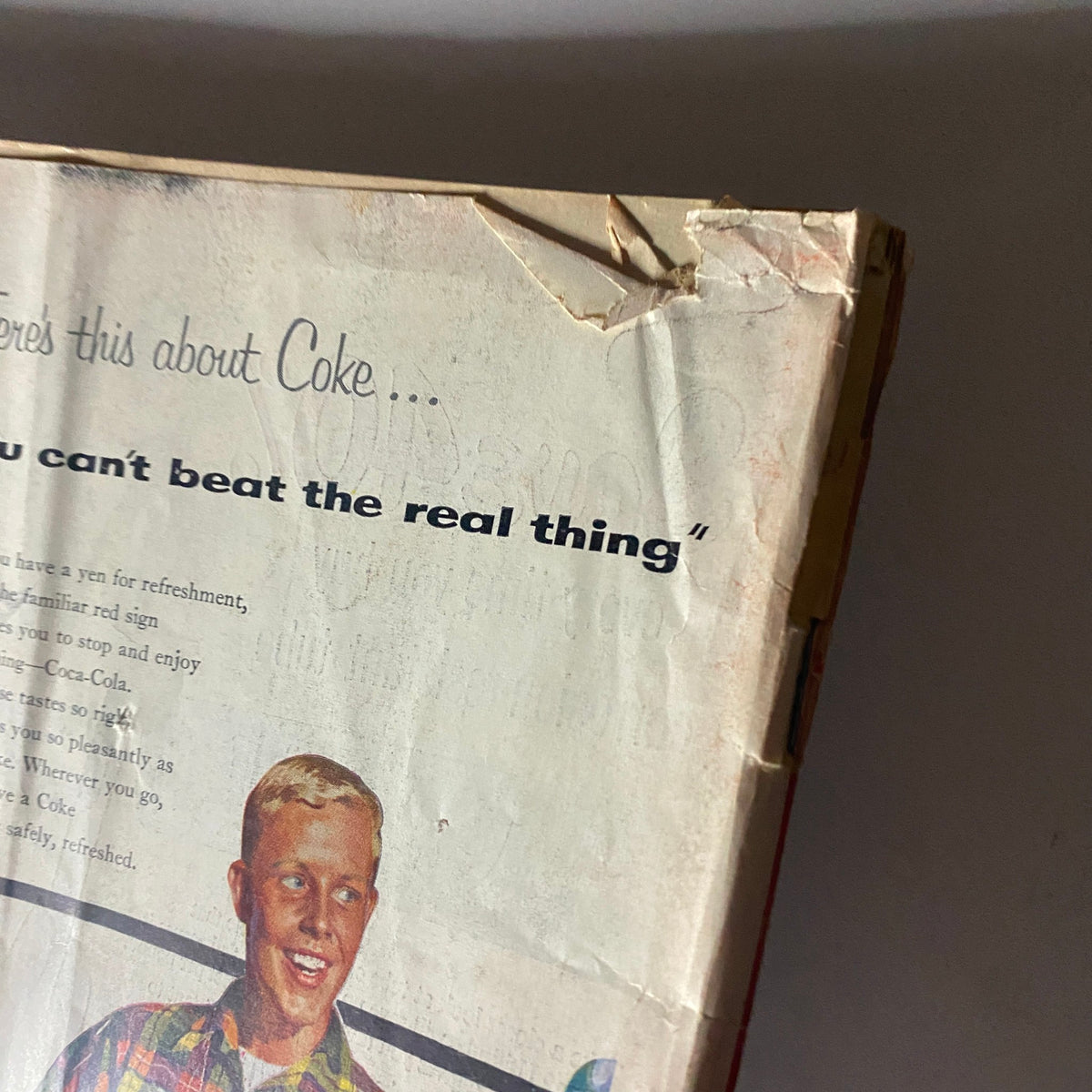 Close-up of a Coca-Cola advertisement showing a young man with a quote stating 'You can't beat the real thing,' from the VTG Time Magazine June 7, 1954 Vol 63 No. 23 Humphrey Bogart as Capt. Queeg.