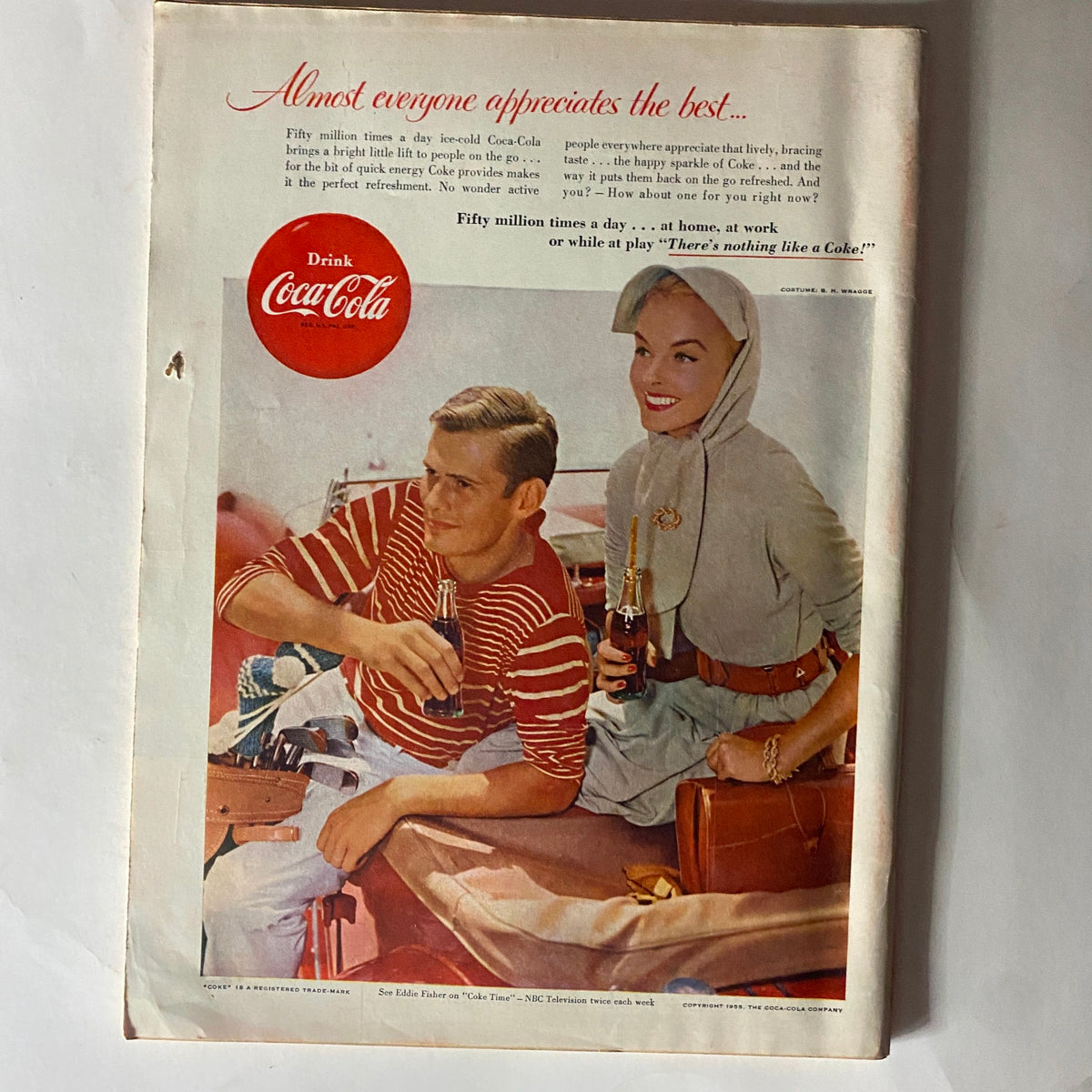 Advertisement page in VTG Time Magazine April 25, 1955 for Coca-Cola, displaying a couple enjoying drinks in a nostalgic 1950s setting.
