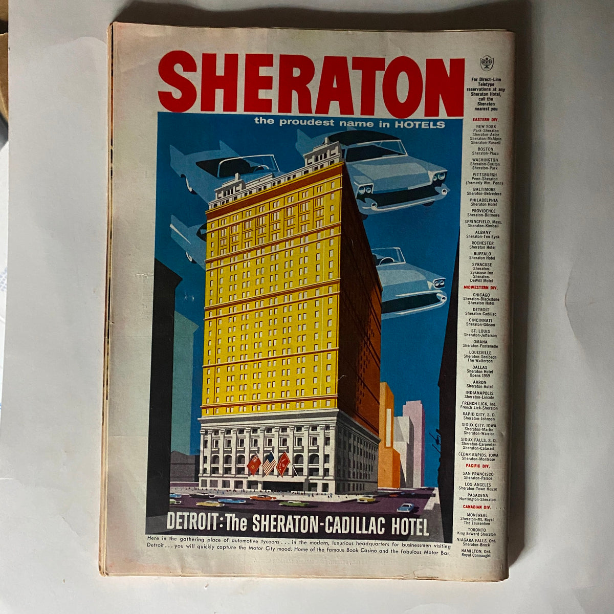 Sheraton Cadillac Hotel vintage advertisement featured in VTG Time Magazine October 14, 1957, showcasing mid-century architecture and automobiles.