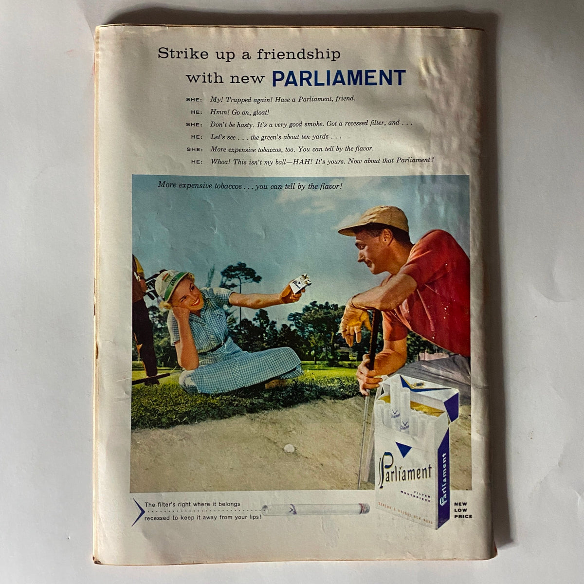 Back cover of VTG Time Magazine July 8, 1957 displaying a colorful advertisement for Parliament cigarettes with a scene of two people interacting on a golf course.