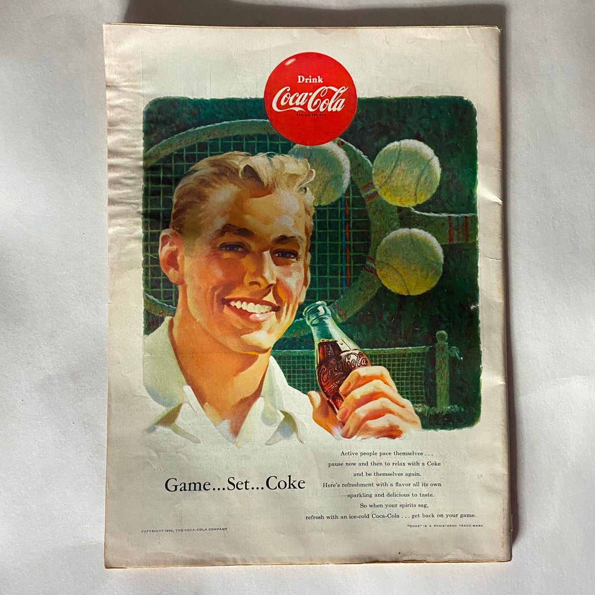 Advertisement from the back cover of the VTG Time Magazine August 31, 1953, Vol 62 No. 9 featuring a vintage Coca-Cola promotion with a smiling man, reflecting mid-20th century marketing.