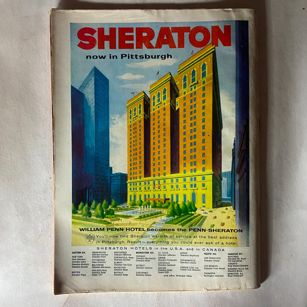 Advertisement page from VTG Time Magazine August 13, 1956 promoting Sheraton hotels with a colorful illustration.