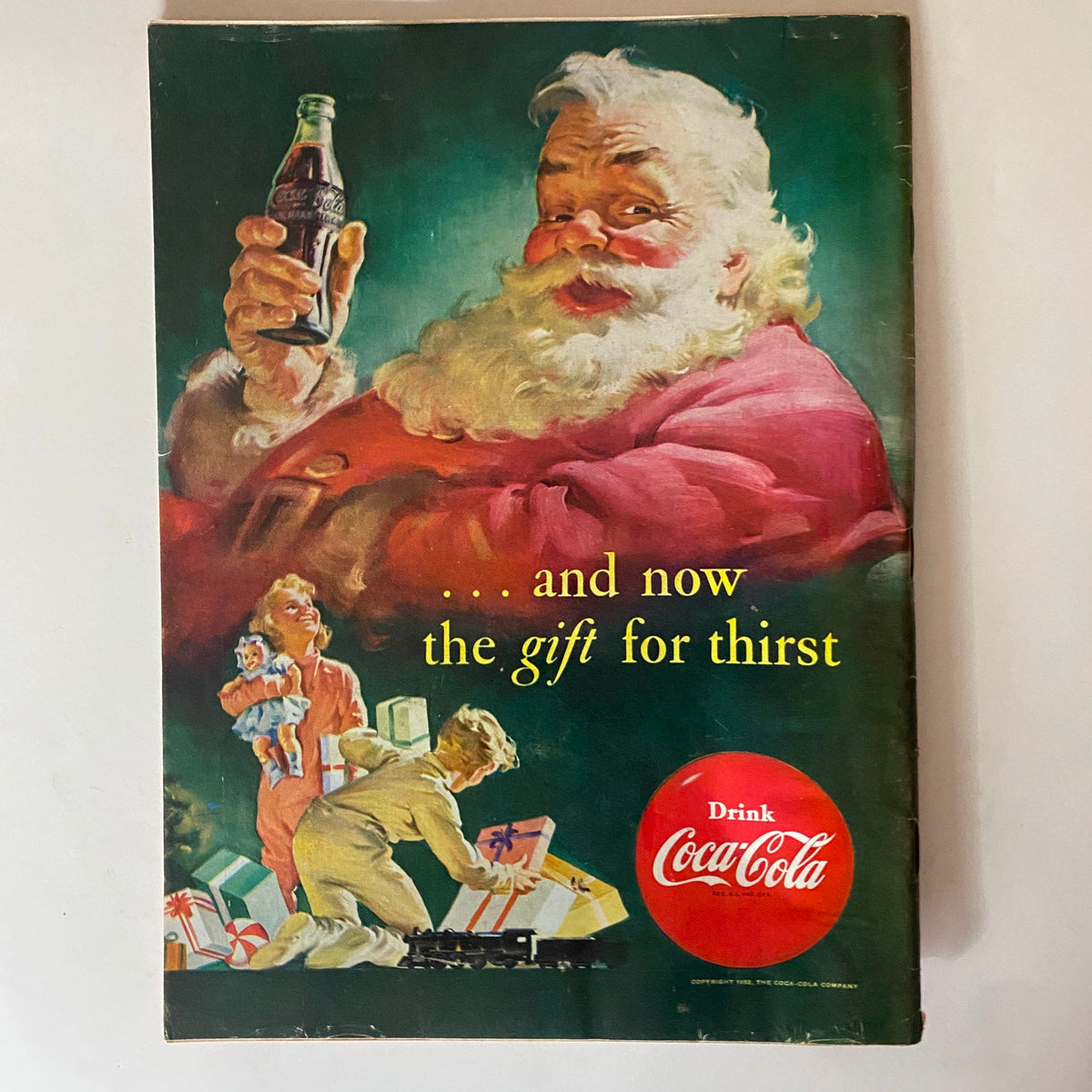 Back advertisement page of VTG Time Magazine December 22, 1952, showcasing a festive Coca-Cola advertisement with Santa Claus and children.