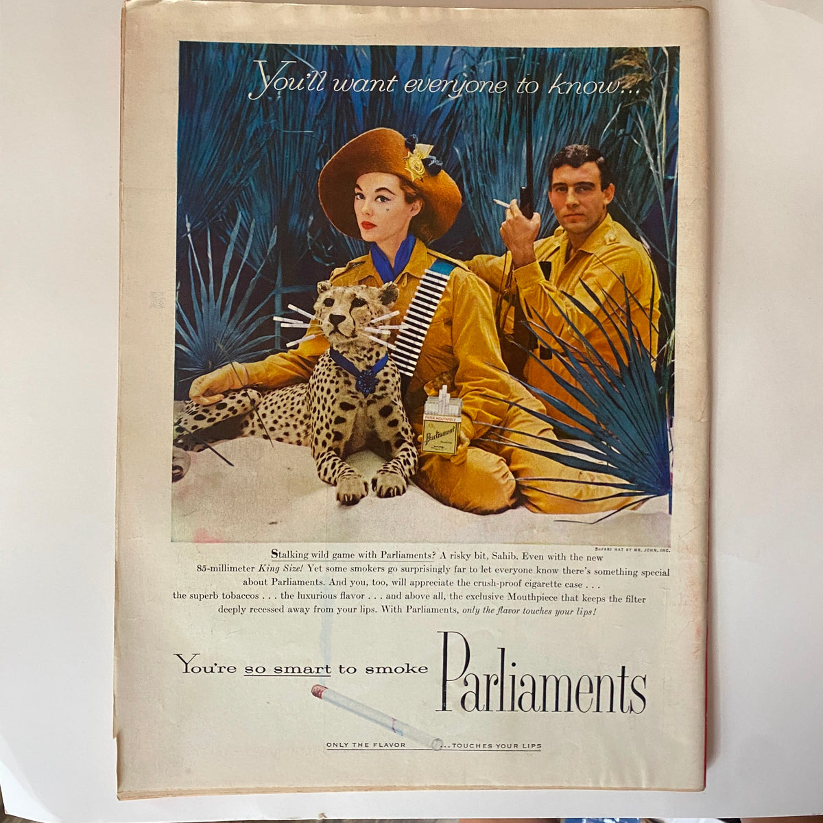 Vintage advertisement from the VTG Time Magazine dated July 2, 1956, featuring a woman in yellow safari attire alongside a leopard, promoting Parliaments cigarettes.